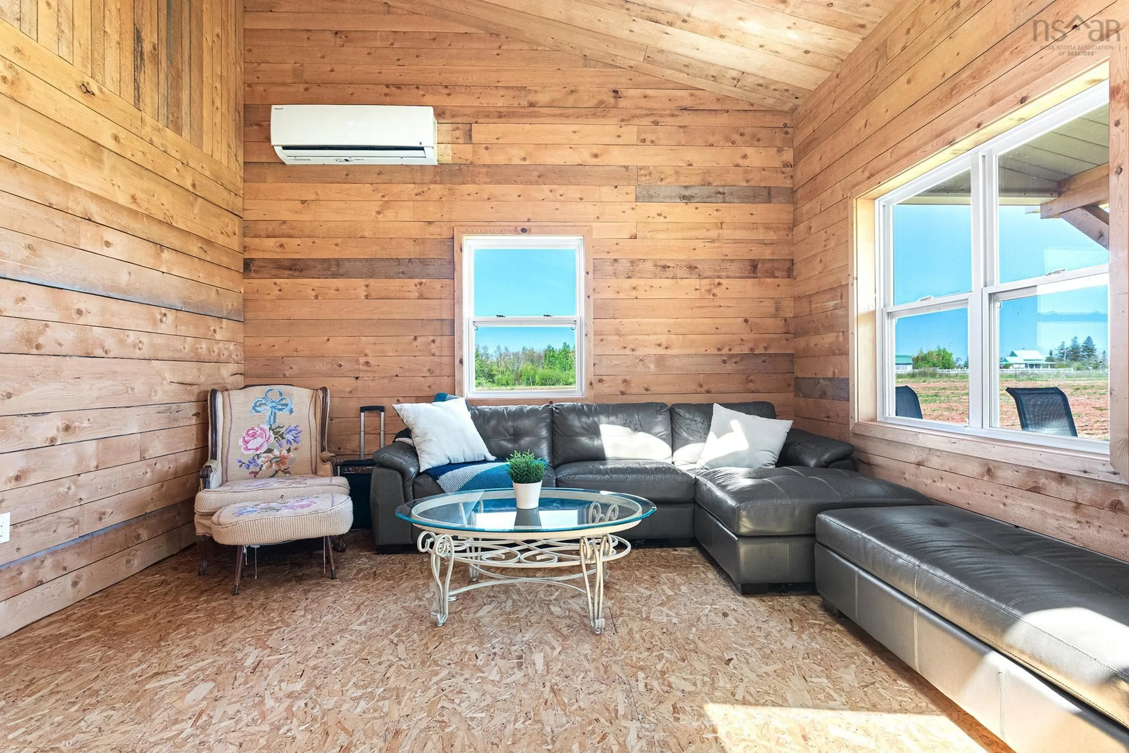 Living room with furniture, wood/laminate floor for 7840 Highway 366, Northport Nova Scotia B4H 3Y2