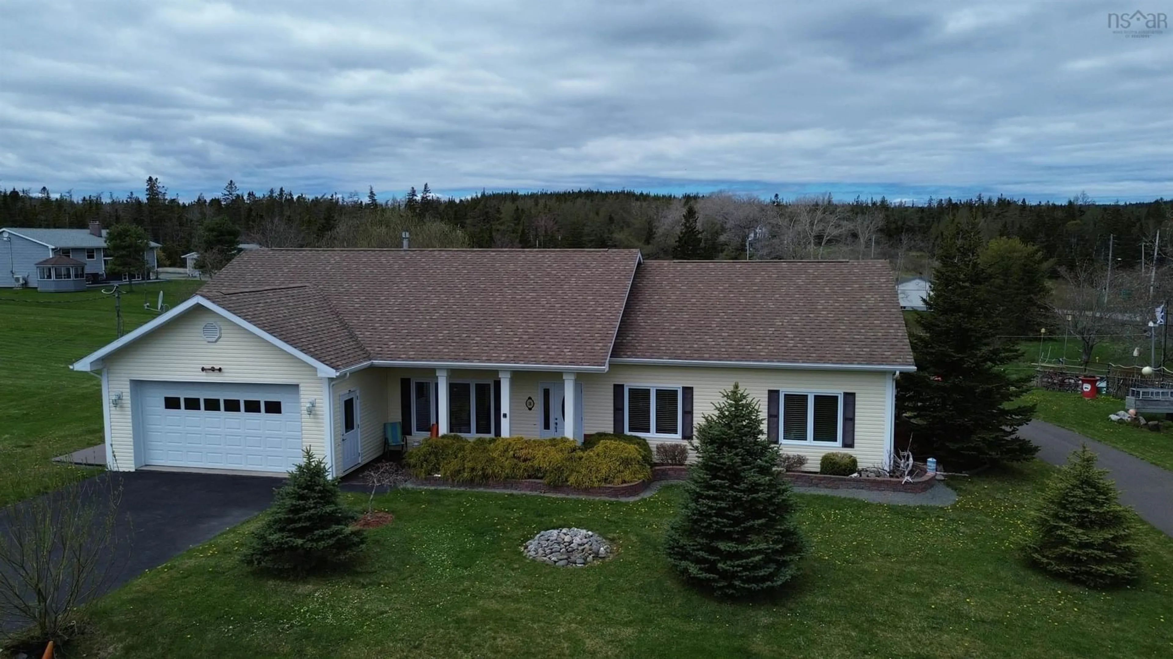 A pic from outside/outdoor area/front of a property/back of a property/a pic from drone, mountain view for 28 Lakeview Dr, St. Peter's Nova Scotia B0E 3B0