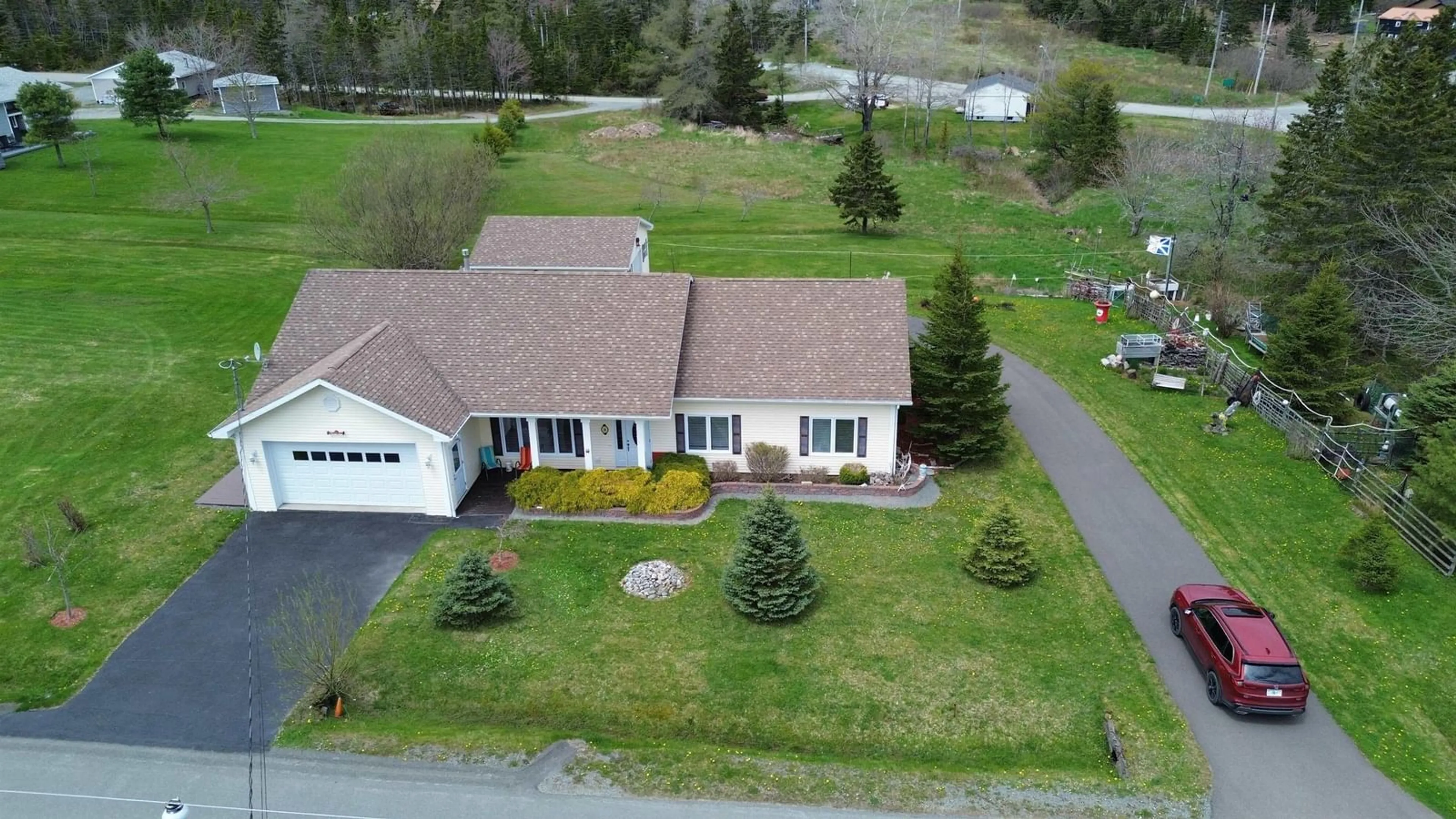 A pic from outside/outdoor area/front of a property/back of a property/a pic from drone, street for 28 Lakeview Dr, St. Peter's Nova Scotia B0E 3B0