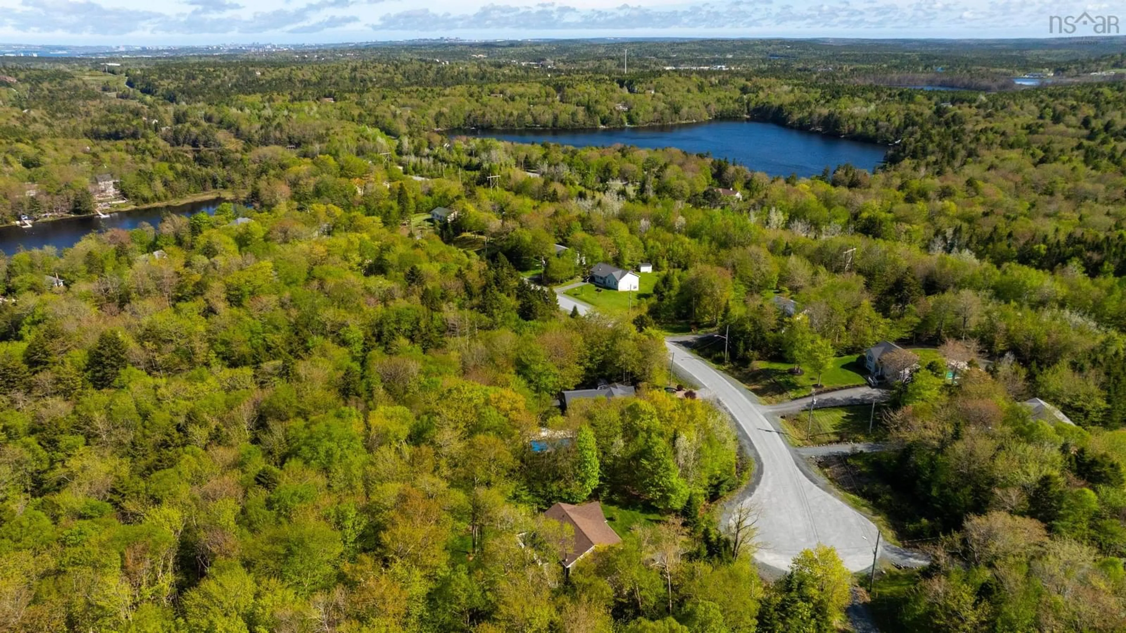 A pic from outside/outdoor area/front of a property/back of a property/a pic from drone, water/lake/river/ocean view for 57 Lodge Ave, Hammonds Plains Nova Scotia B4B 1W2