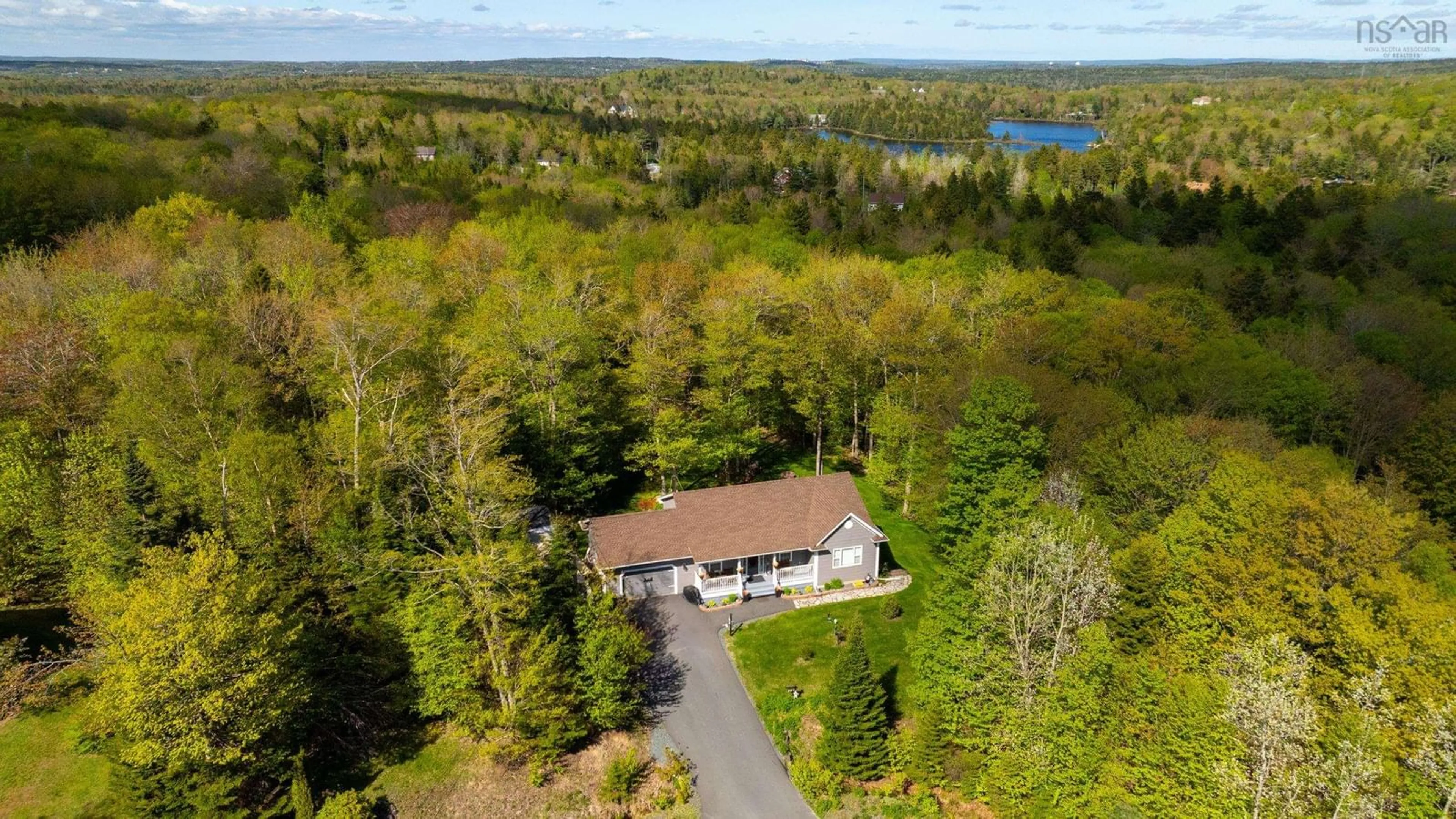 A pic from outside/outdoor area/front of a property/back of a property/a pic from drone, water/lake/river/ocean view for 57 Lodge Ave, Hammonds Plains Nova Scotia B4B 1W2