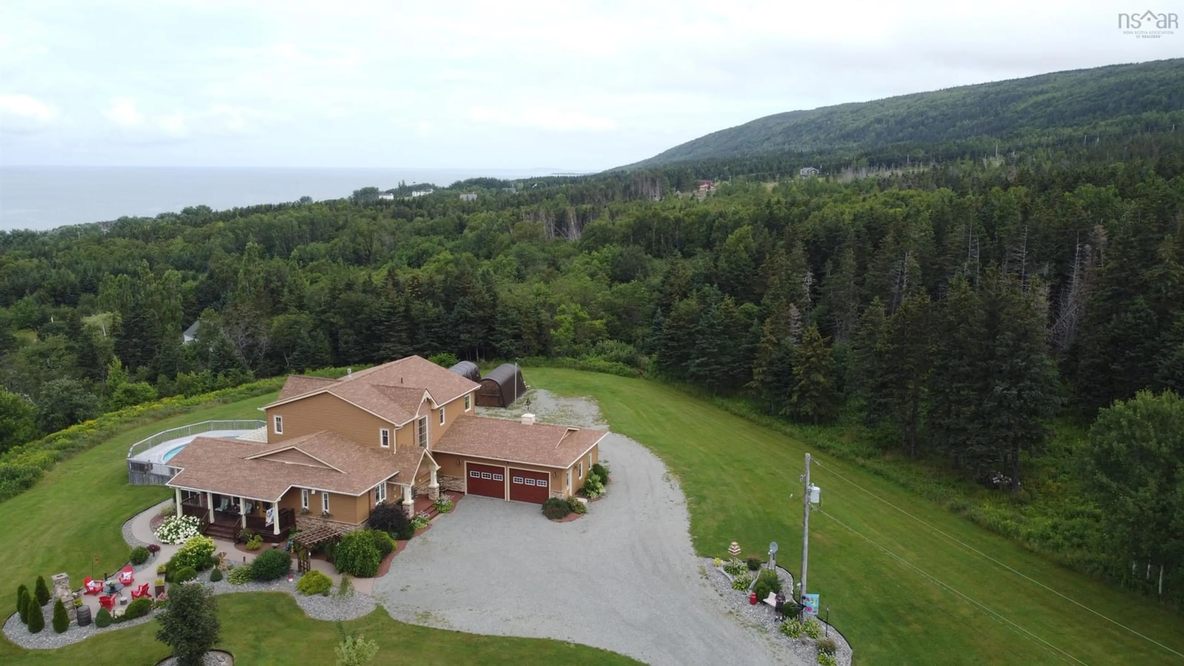 A pic from outside/outdoor area/front of a property/back of a property/a pic from drone, water/lake/river/ocean view for 75 Macdonald Dr, Creignish Nova Scotia B9A 1C7