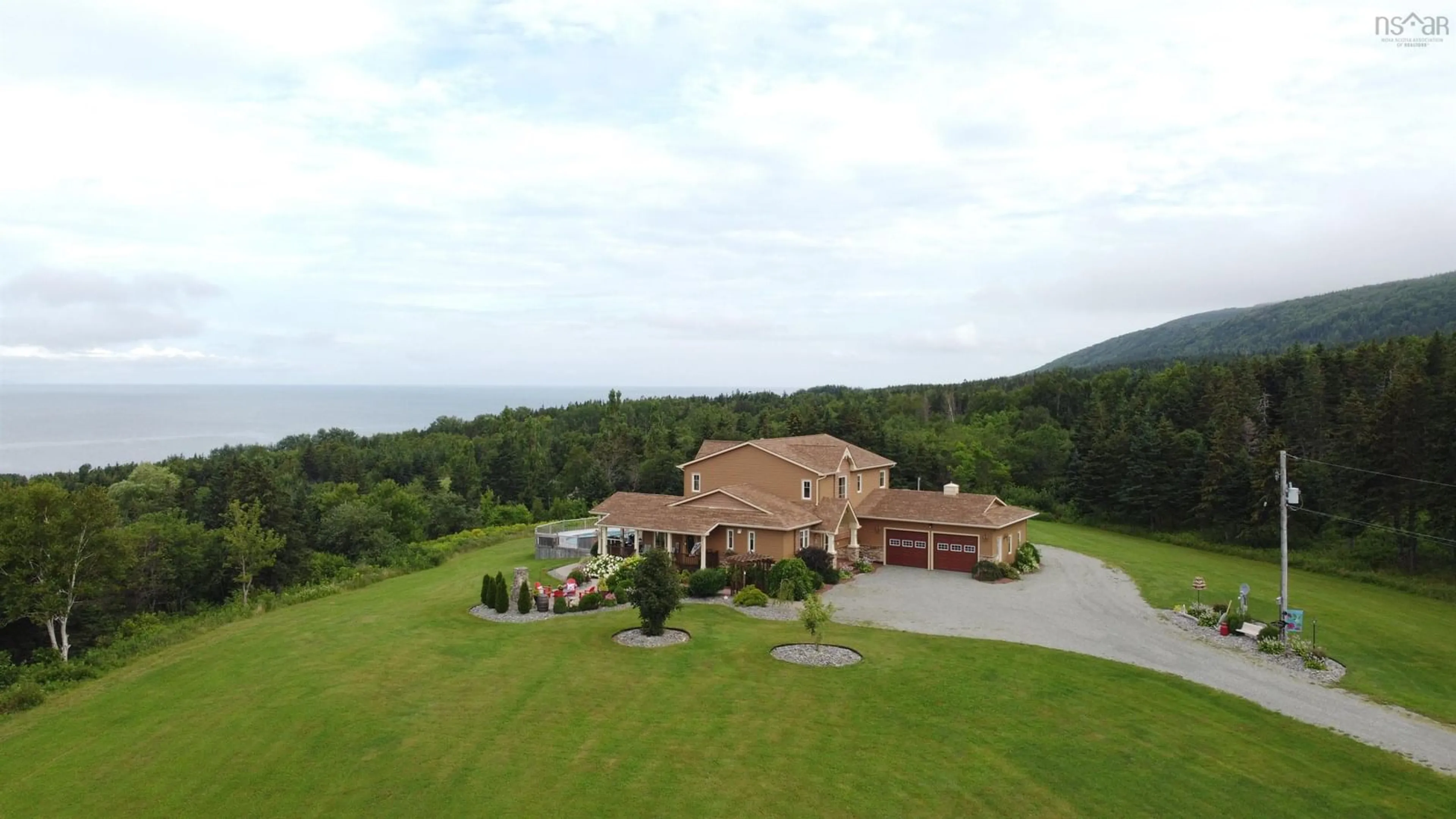 A pic from outside/outdoor area/front of a property/back of a property/a pic from drone, unknown for 75 Macdonald Dr, Creignish Nova Scotia B9A 1C7