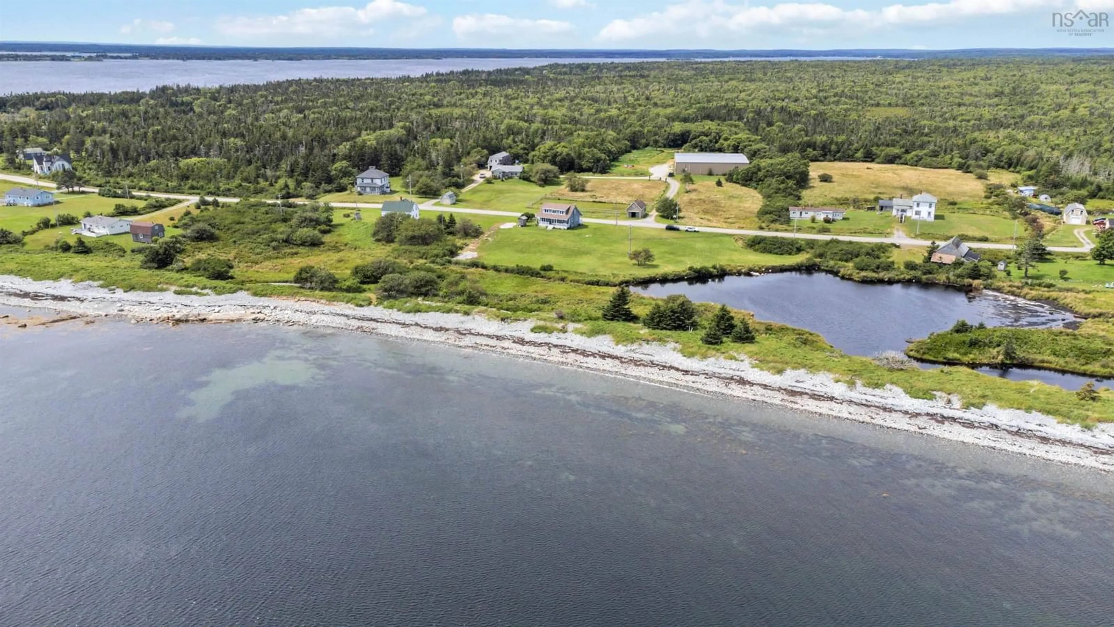 A pic from outside/outdoor area/front of a property/back of a property/a pic from drone, water/lake/river/ocean view for 5157 Shore Rd, North East Harbour Nova Scotia B0T 1W0