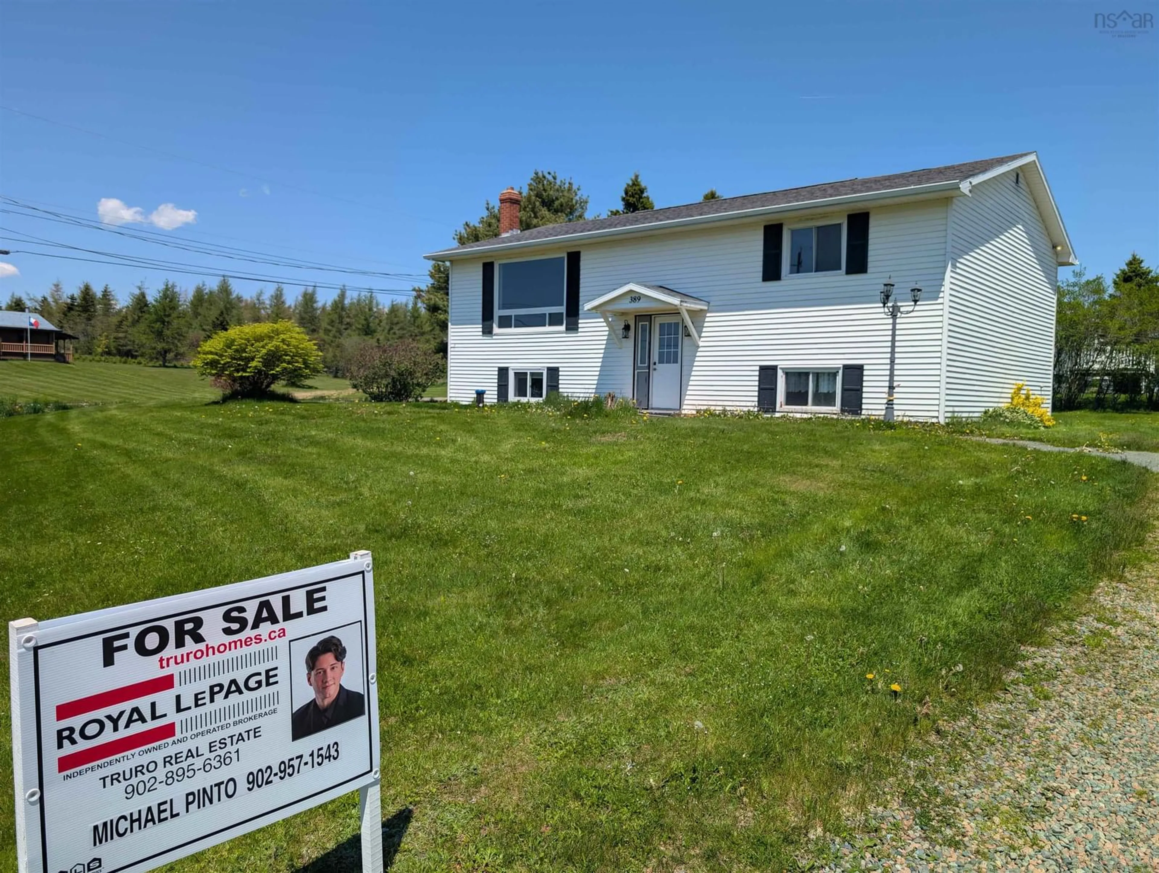 Home with vinyl exterior material, street for 389 Shore Rd, Masstown Nova Scotia B0M 1G0