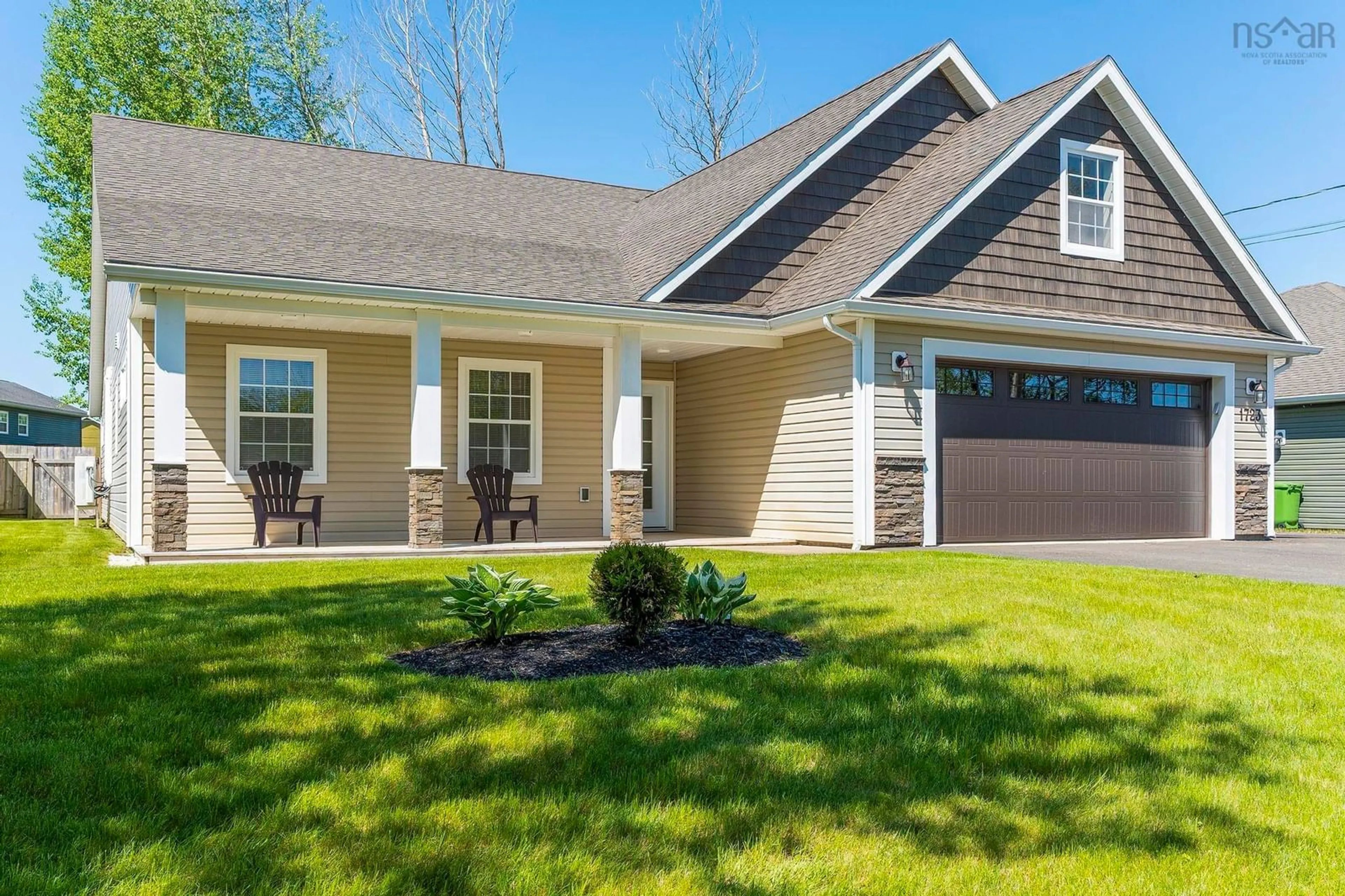 Home with vinyl exterior material, street for 1723 Greenwood Rd, Kingston Nova Scotia B0P 1R0