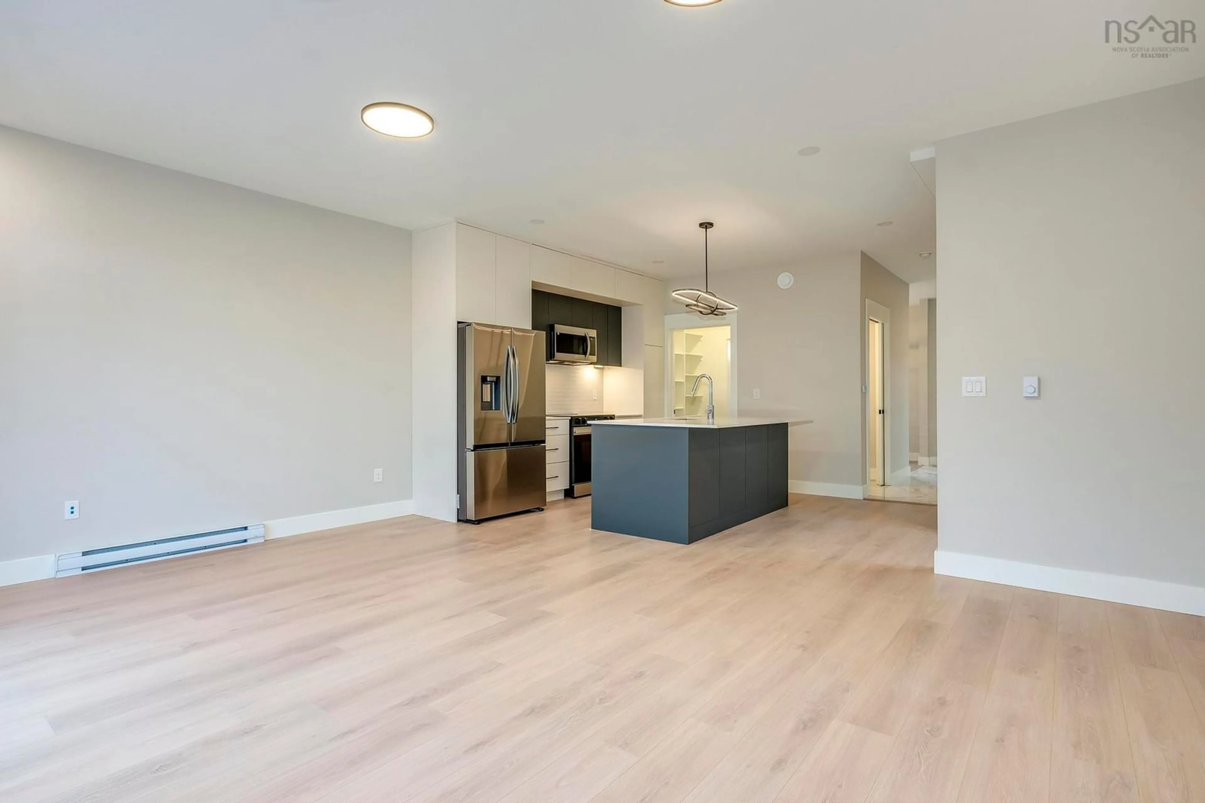 Open concept kitchen, wood/laminate floor for 175 Colonial Cres #82B, Halifax Nova Scotia B3R 2H8