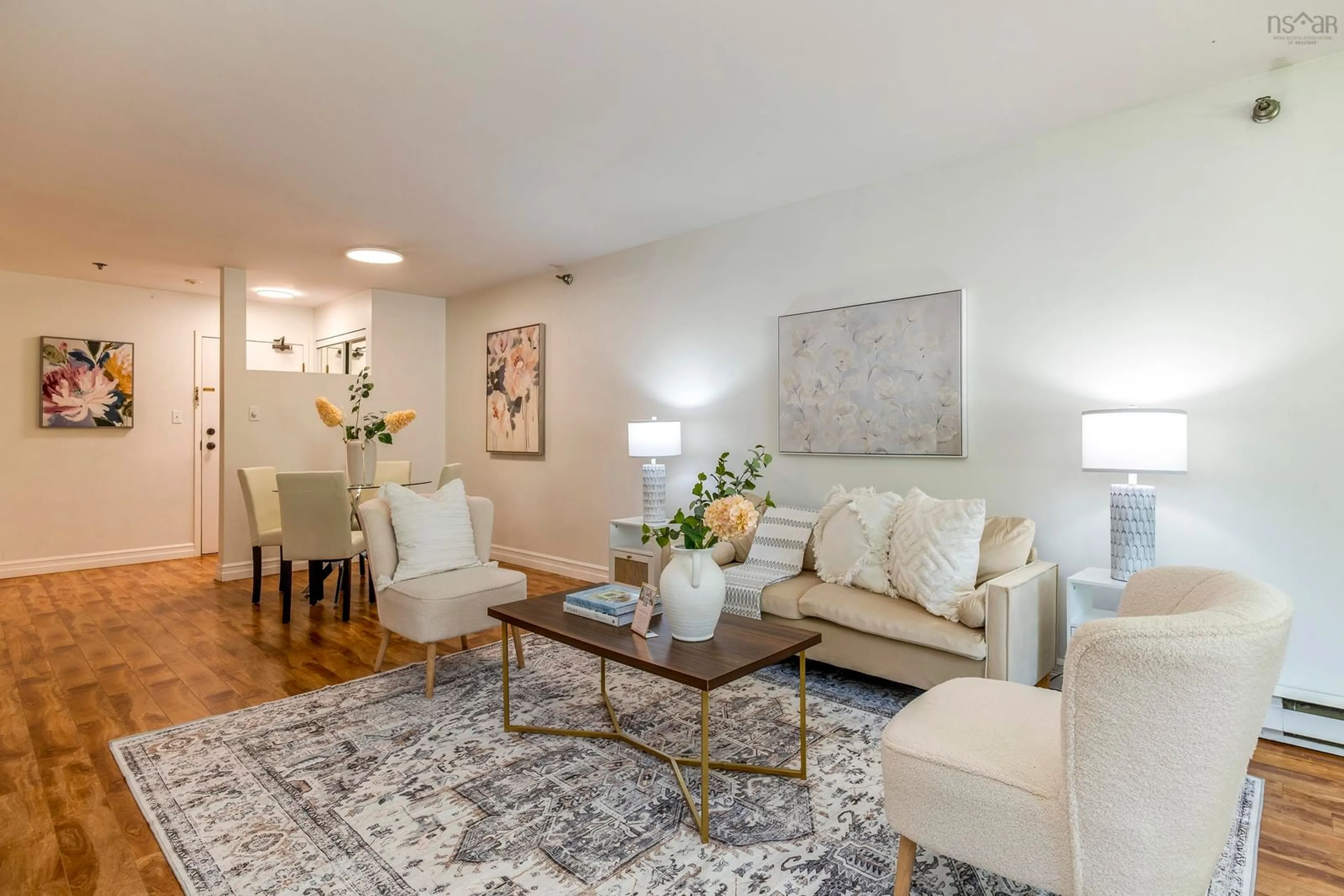 Living room with furniture, wood/laminate floor for 83 Kearney Lake Rd #209, Halifax Nova Scotia B3M 4E6