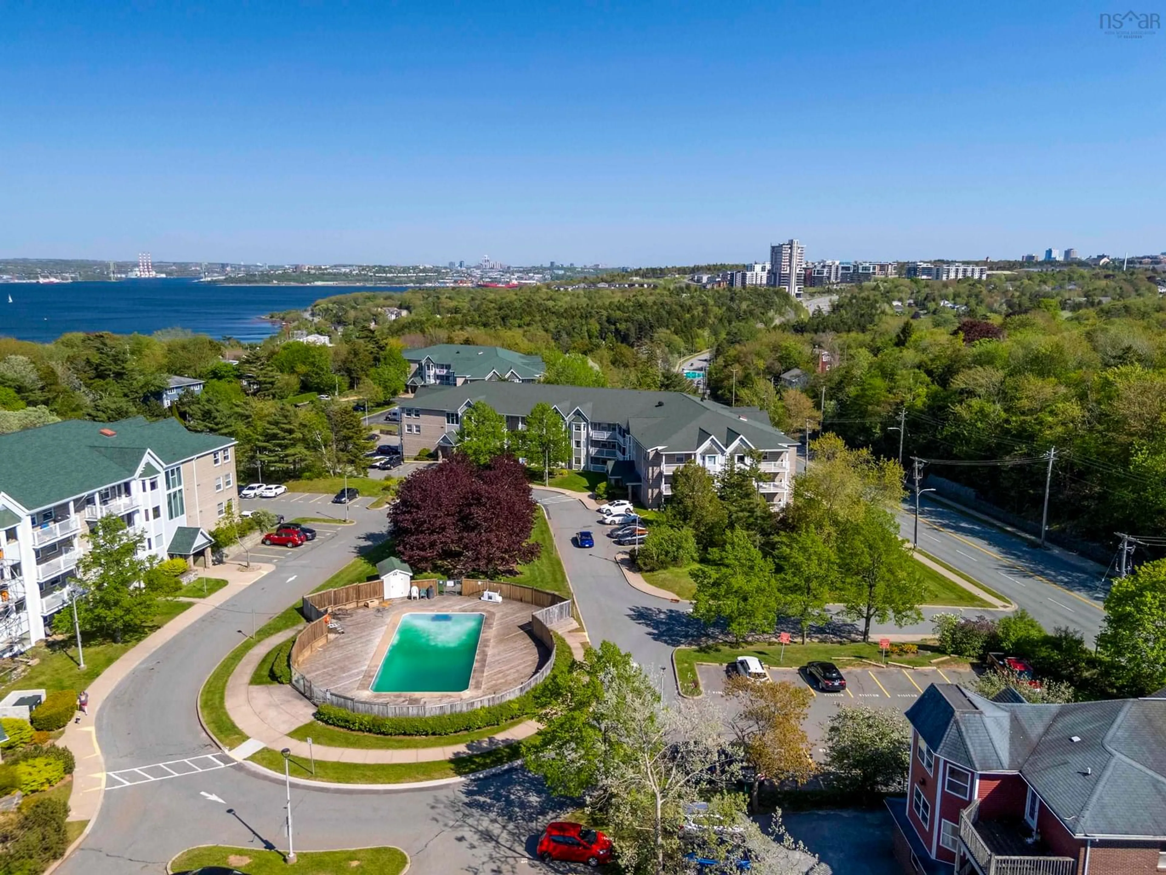 A pic from outside/outdoor area/front of a property/back of a property/a pic from drone, water/lake/river/ocean view for 83 Kearney Lake Rd #209, Halifax Nova Scotia B3M 4E6