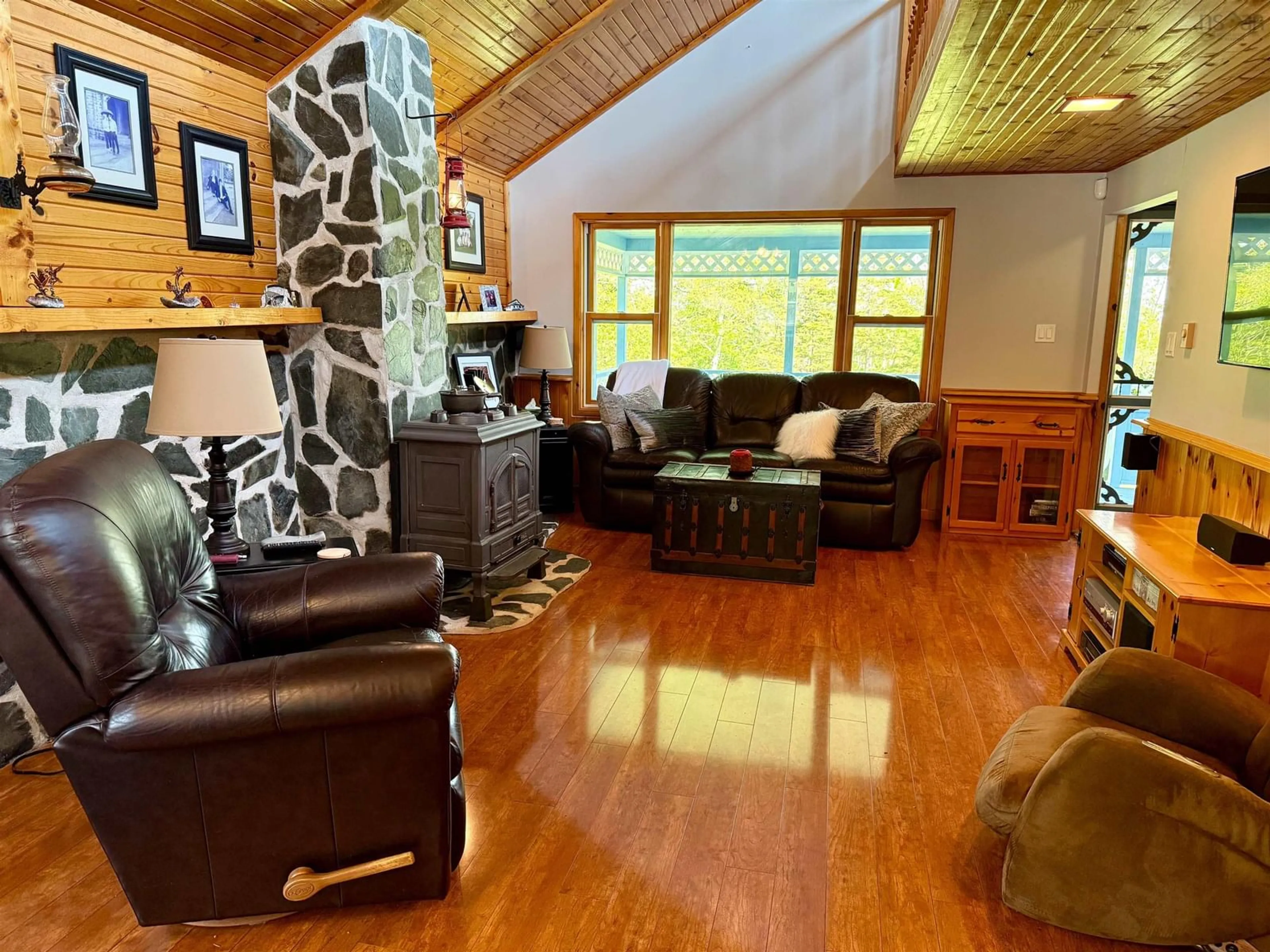 Living room with furniture, wood/laminate floor for 16 Chemin A Dedo Rd, Wedgeport Nova Scotia B0W 3P0