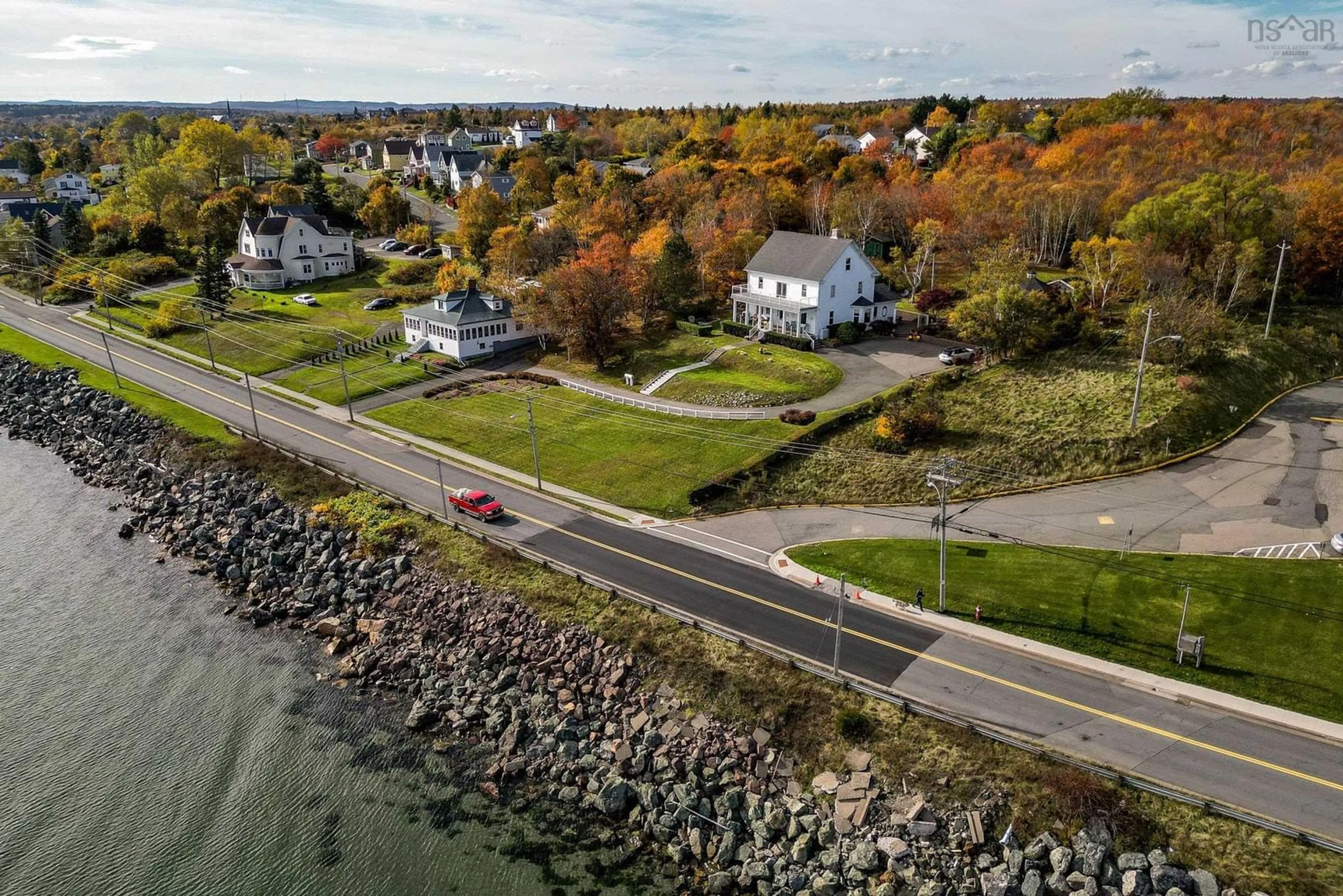 A pic from outside/outdoor area/front of a property/back of a property/a pic from drone, water/lake/river/ocean view for 516 Purves St, North Sydney Nova Scotia B2A 1E2