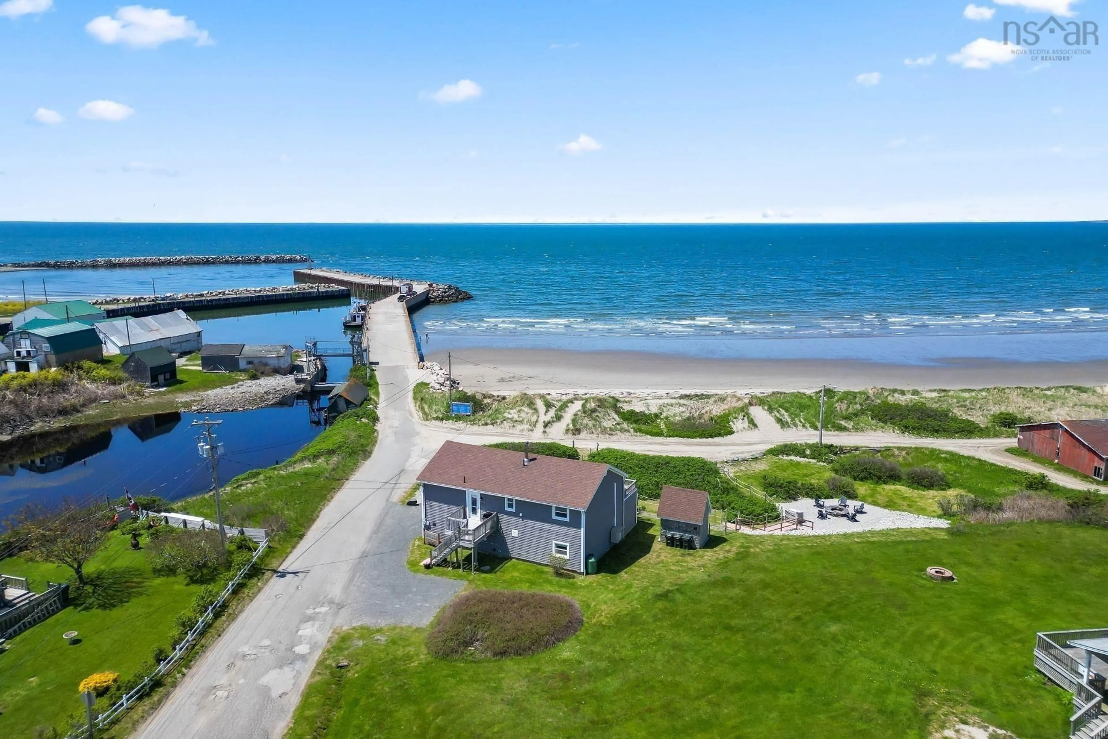 A pic from outside/outdoor area/front of a property/back of a property/a pic from drone, water/lake/river/ocean view for 3291 Main Shore Rd, Port Maitland Nova Scotia B5A 5W3