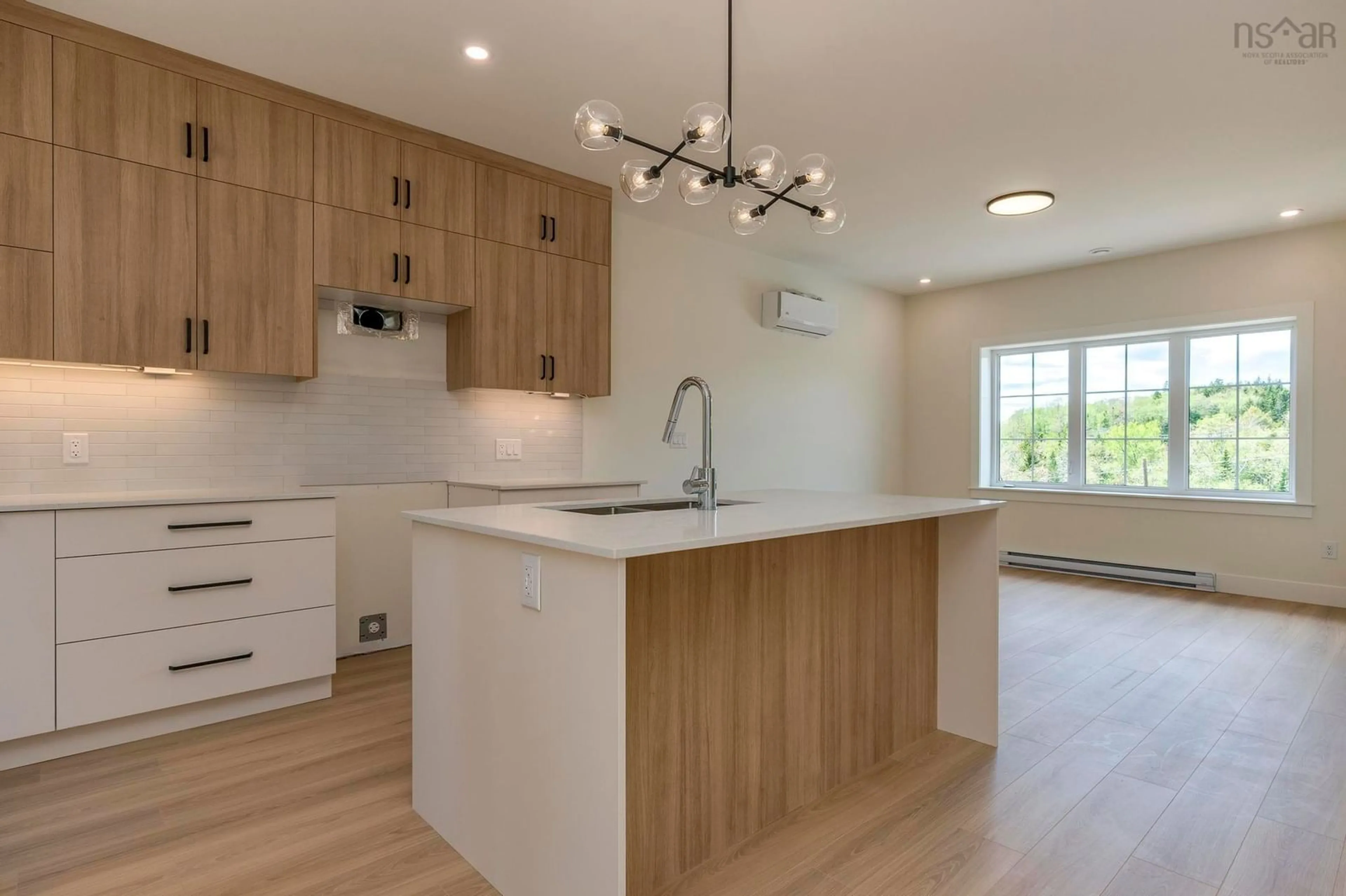 Open concept kitchen, wood/laminate floor for 44 Sweetfern Lane, Middle Sackville Nova Scotia B4E 0W8
