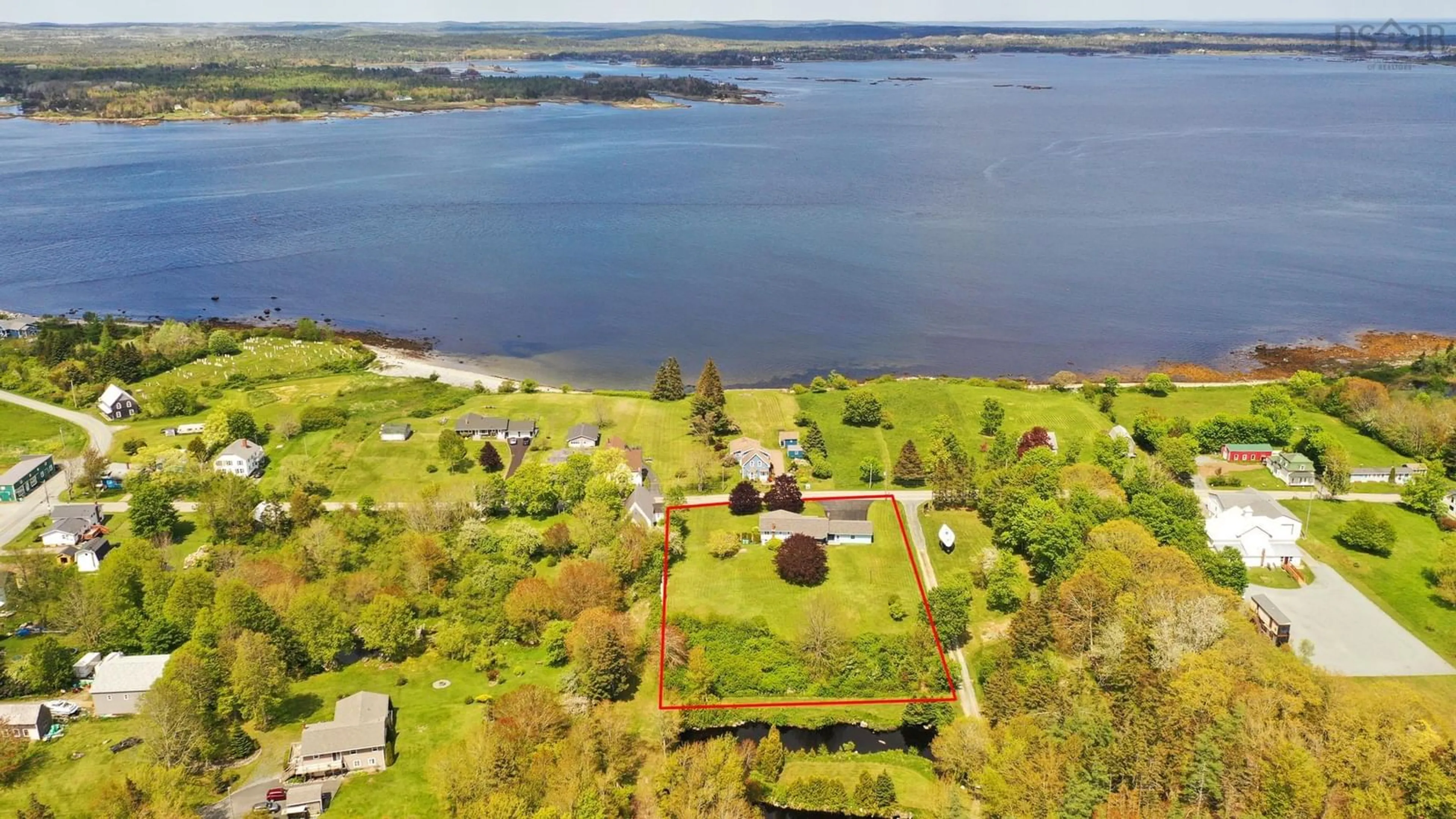 A pic from outside/outdoor area/front of a property/back of a property/a pic from drone, water/lake/river/ocean view for 46 Long Cove Rd, Port Medway Nova Scotia B0J 2T0