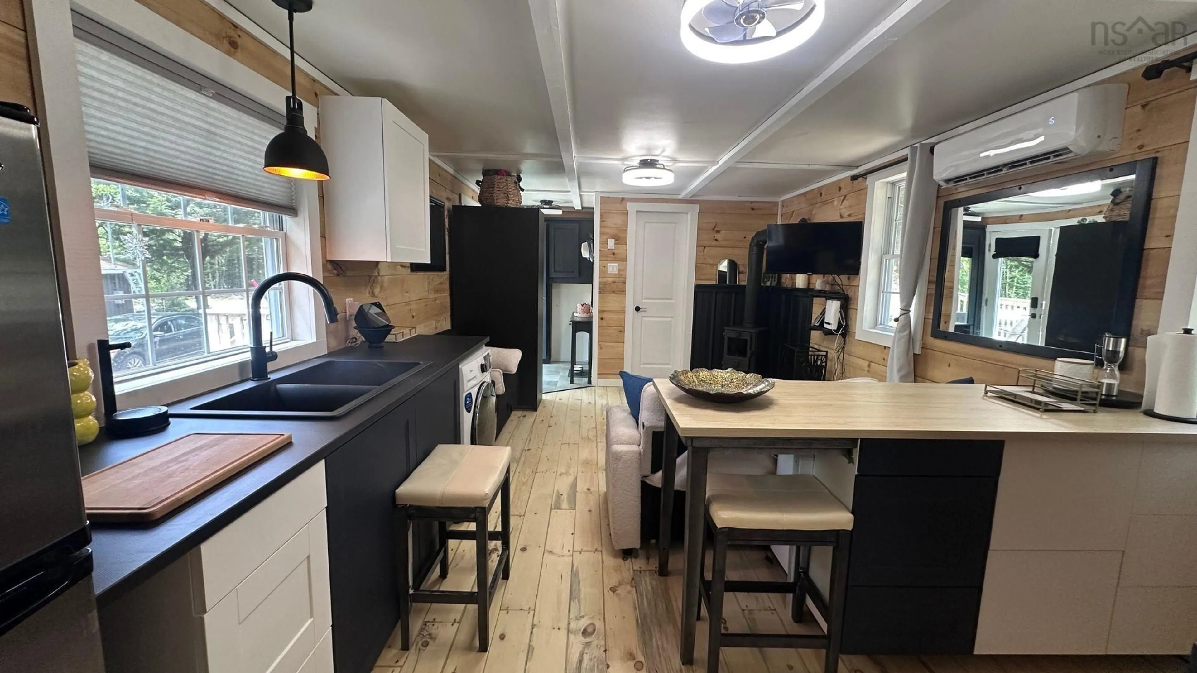 Open concept kitchen, wood/laminate floor for 731 Baker Point Rd, Molega North Nova Scotia B0T 1X0