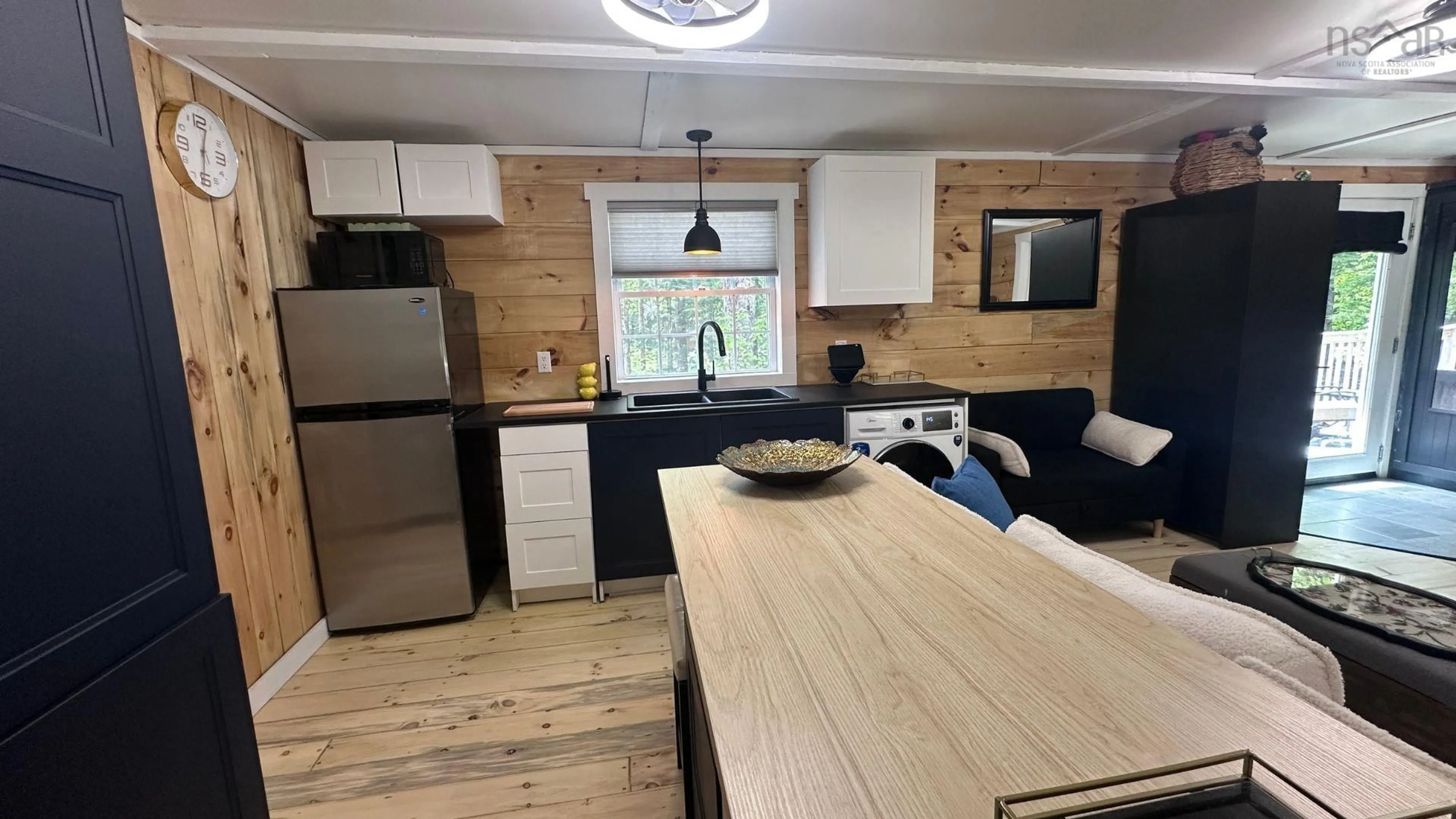 Open concept kitchen, wood/laminate floor for 731 Baker Point Rd, Molega North Nova Scotia B0T 1X0