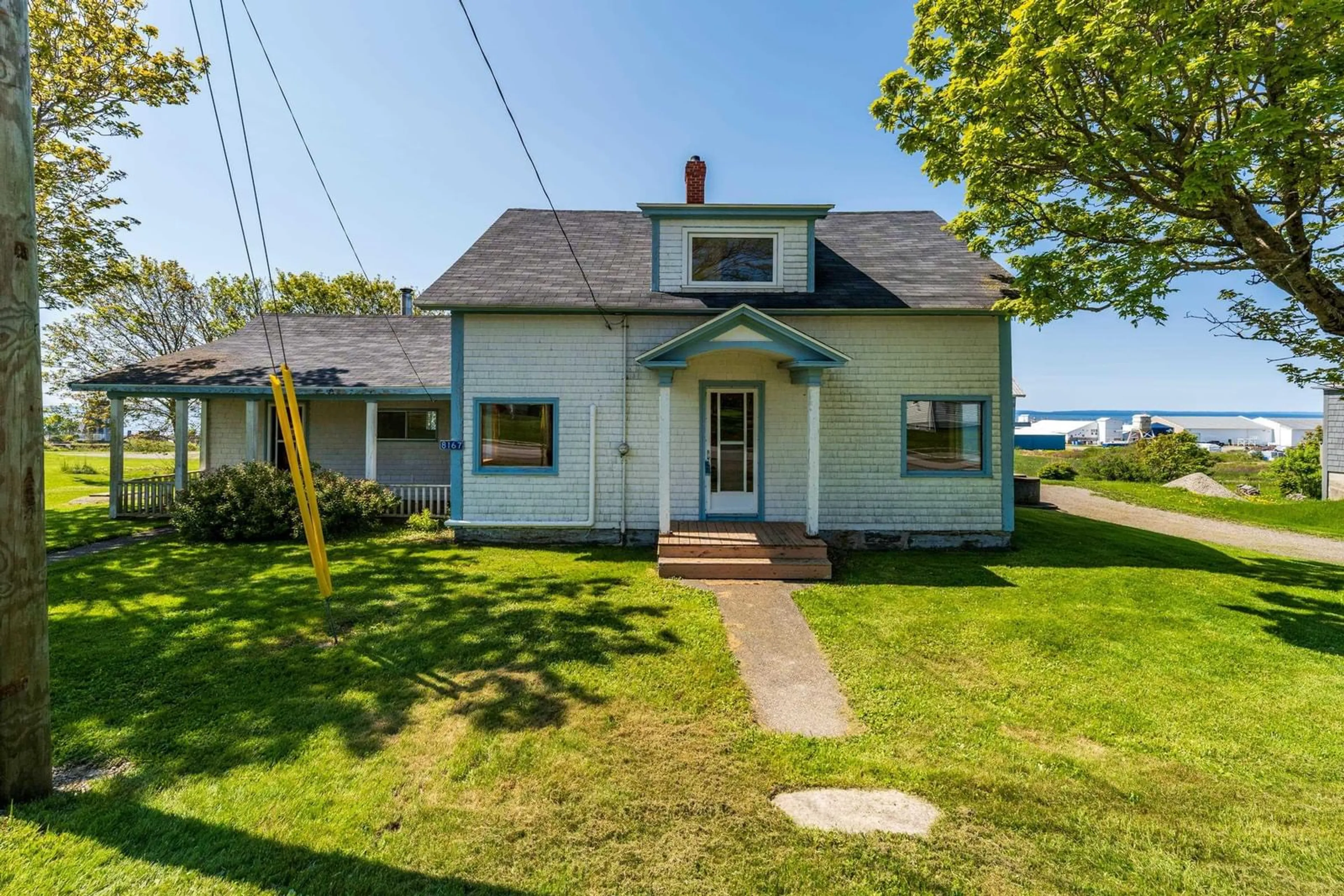 A pic from outside/outdoor area/front of a property/back of a property/a pic from drone, water/lake/river/ocean view for 8167 Highway 1, Meteghan Nova Scotia B0W 2J0