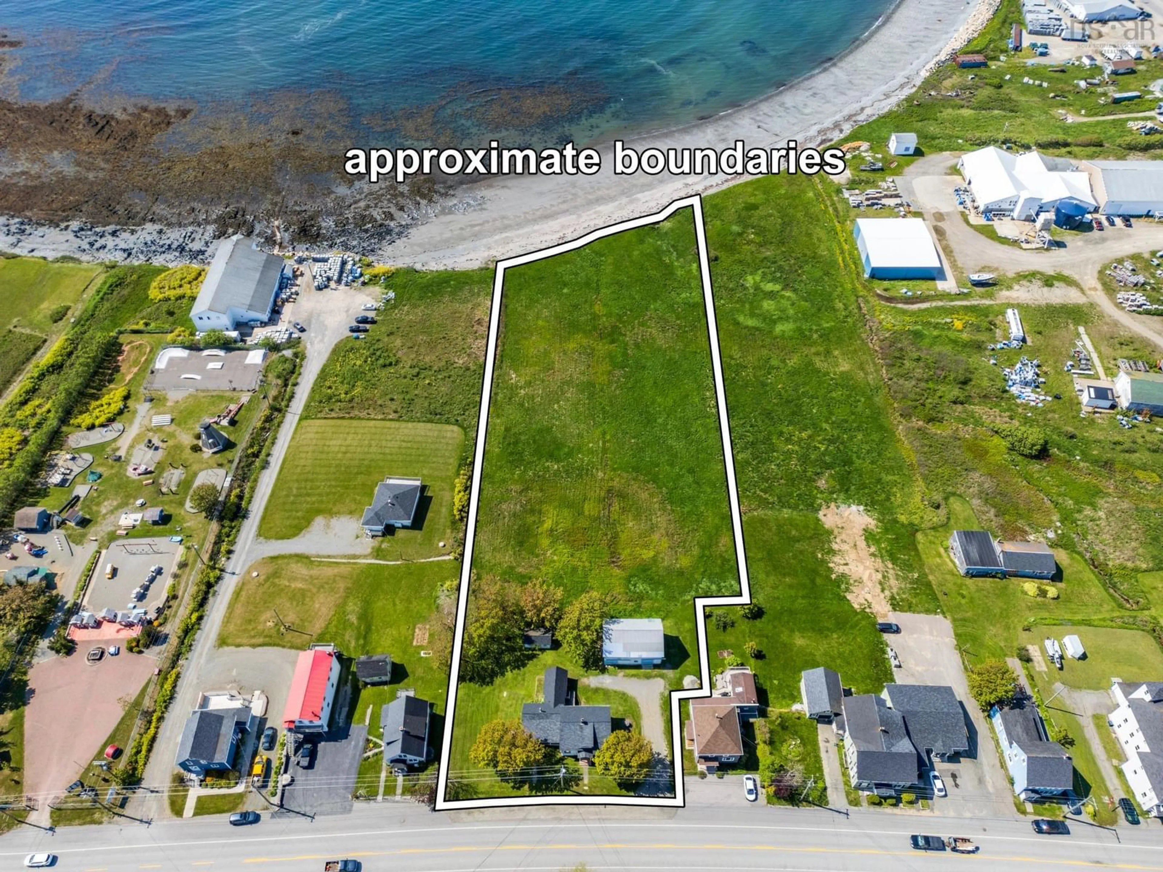 A pic from outside/outdoor area/front of a property/back of a property/a pic from drone, water/lake/river/ocean view for 8167 Highway 1, Meteghan Nova Scotia B0W 2J0