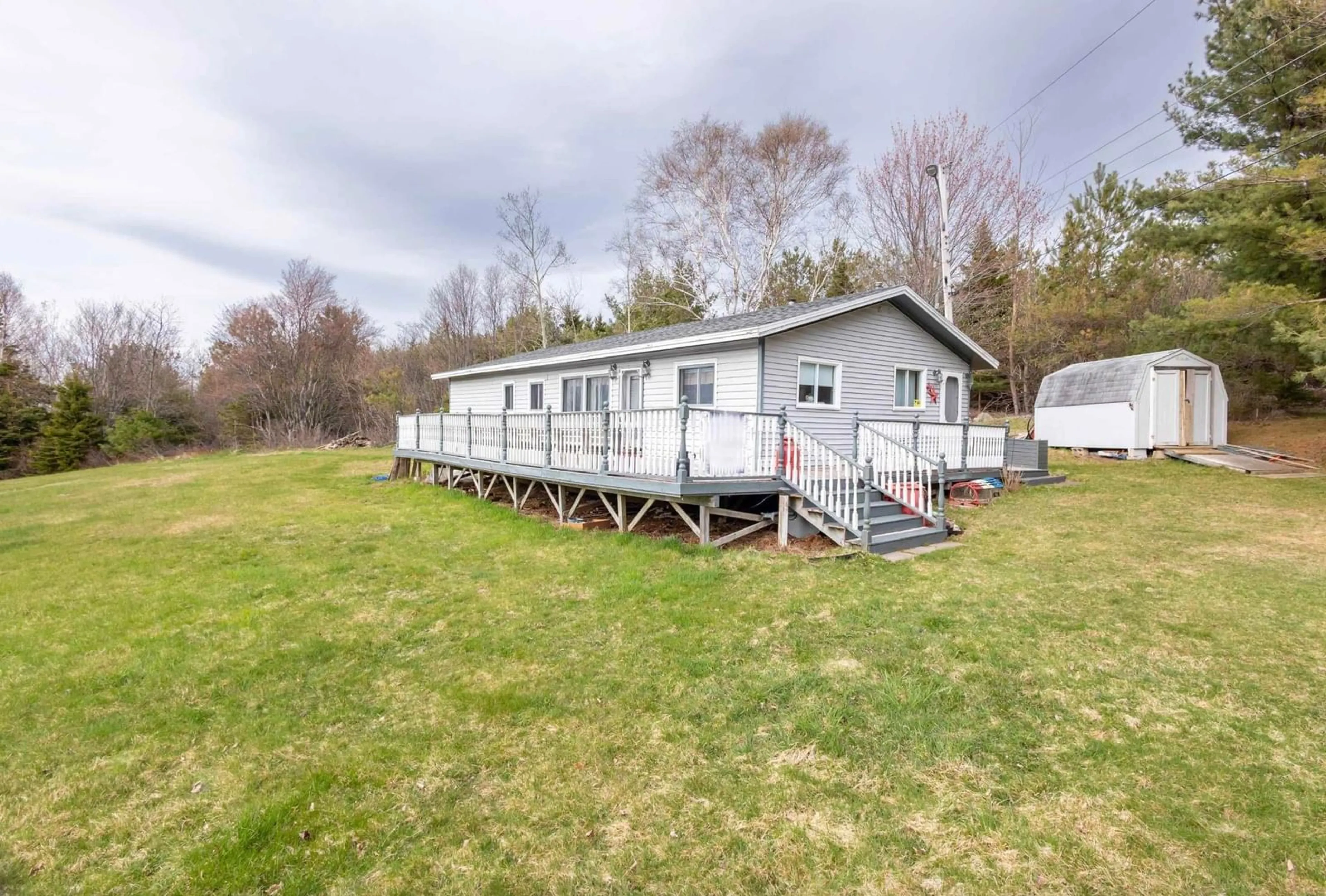 A pic from outside/outdoor area/front of a property/back of a property/a pic from drone, water/lake/river/ocean view for 19 Channel Rd, Boisdale Nova Scotia B1Y 3T2