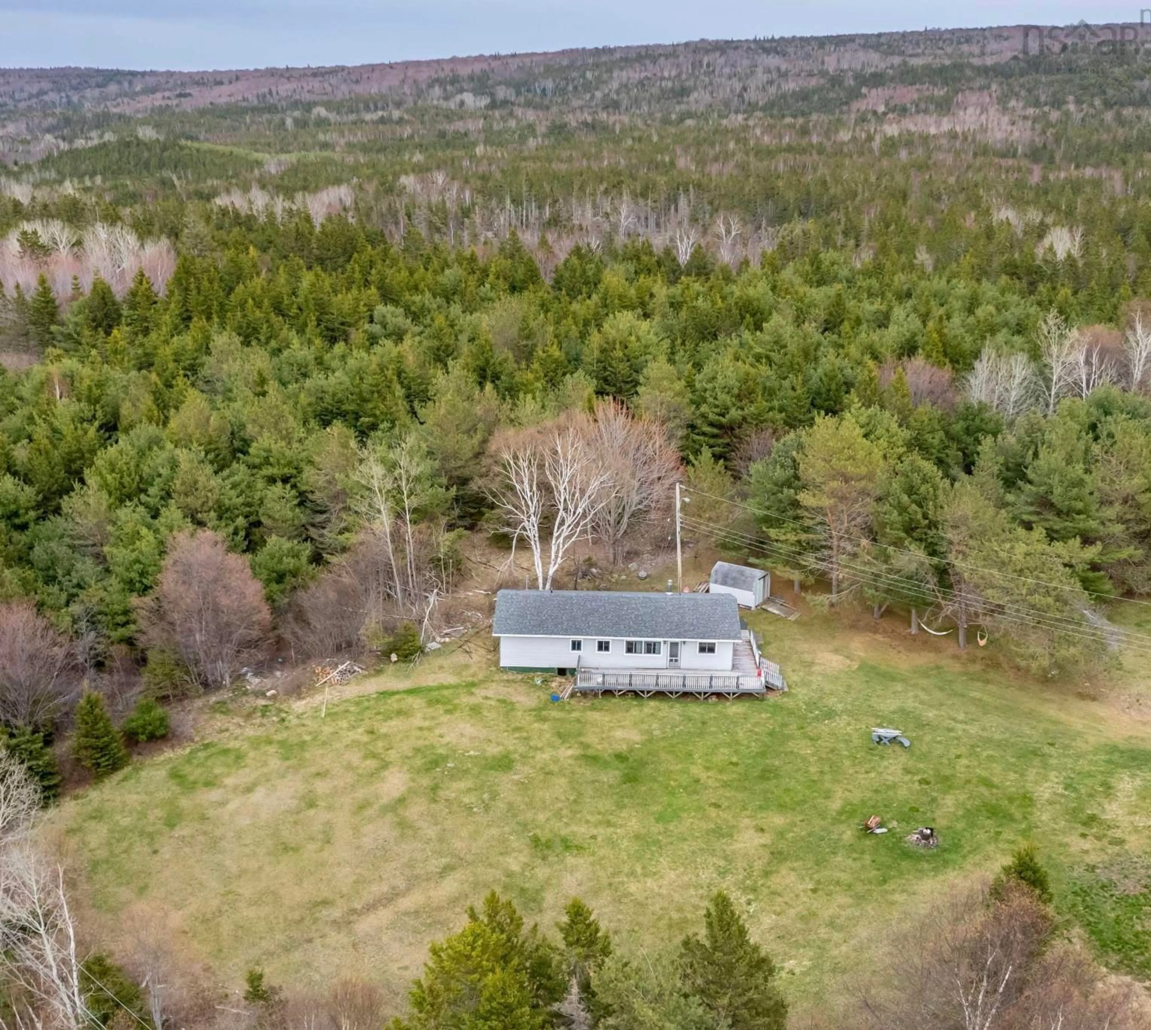 A pic from outside/outdoor area/front of a property/back of a property/a pic from drone, forest/trees view for 19 Channel Rd, Boisdale Nova Scotia B1Y 3T2