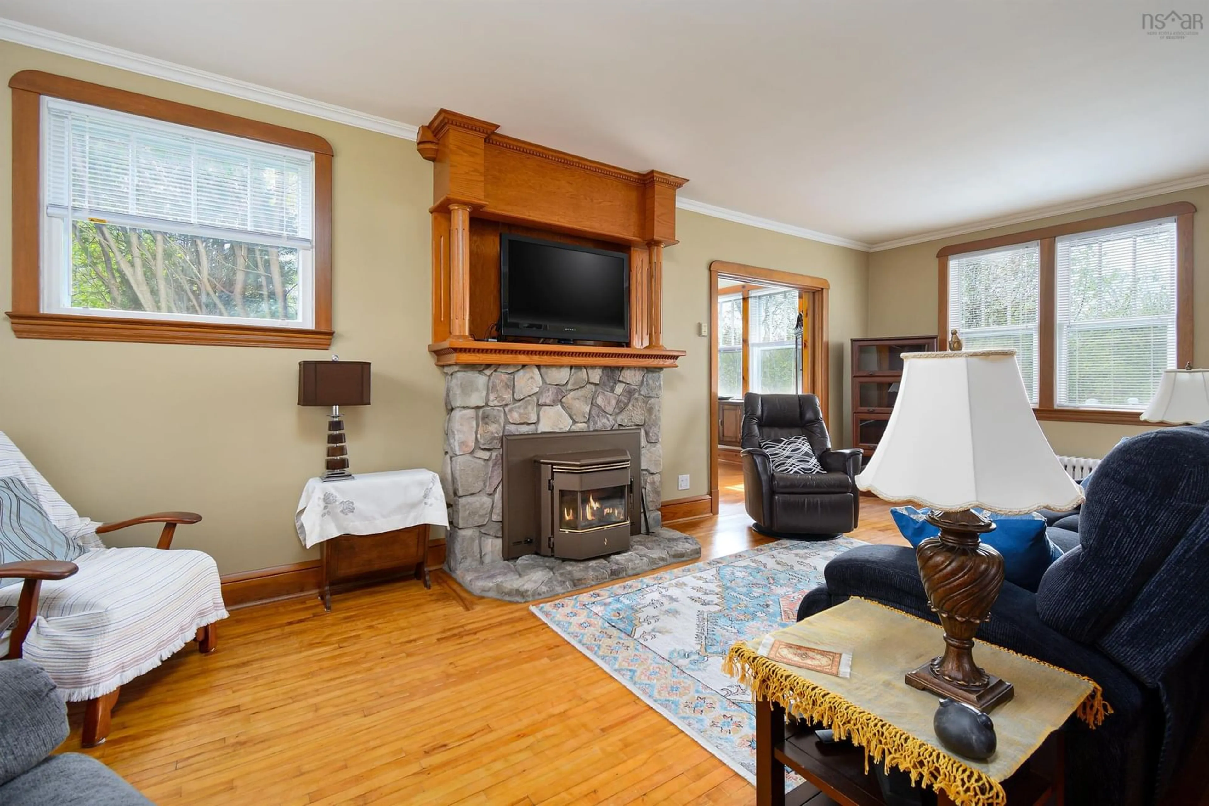 Living room with furniture, wood/laminate floor for 142 Shandwick St, Sydney Nova Scotia B1P 4V6