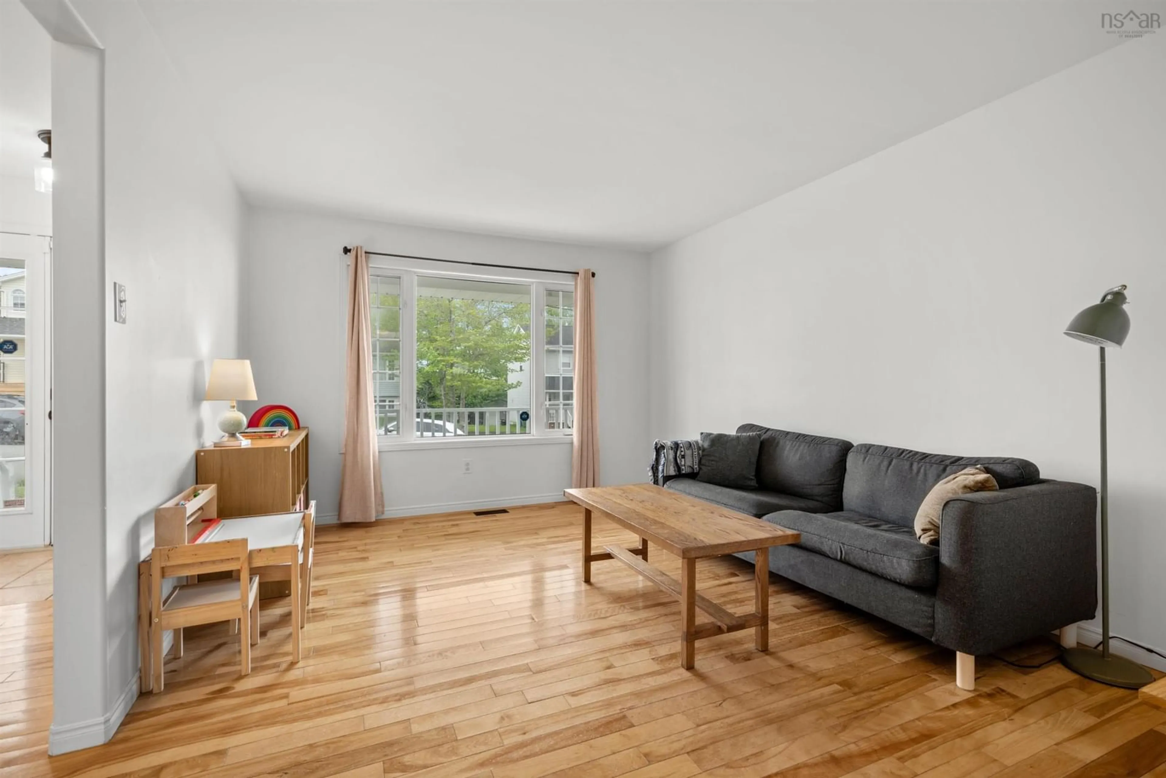 Living room with furniture, wood/laminate floor for 73 Madeira Crescent, Dartmouth Nova Scotia B2W 6G8