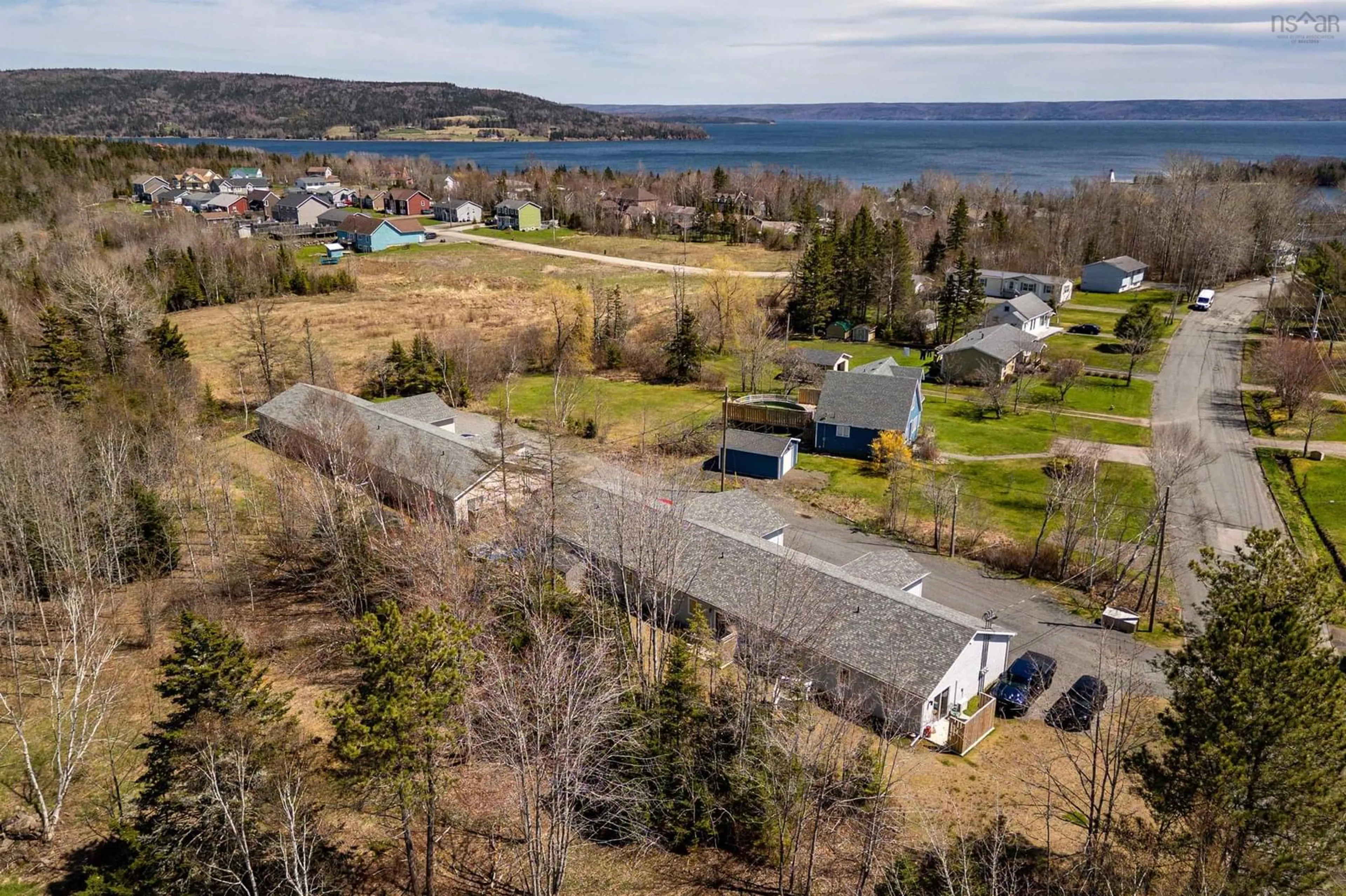 A pic from outside/outdoor area/front of a property/back of a property/a pic from drone, water/lake/river/ocean view for 1-6 Daisy Lane    Baddeck, Baddeck Nova Scotia B0E 1B0