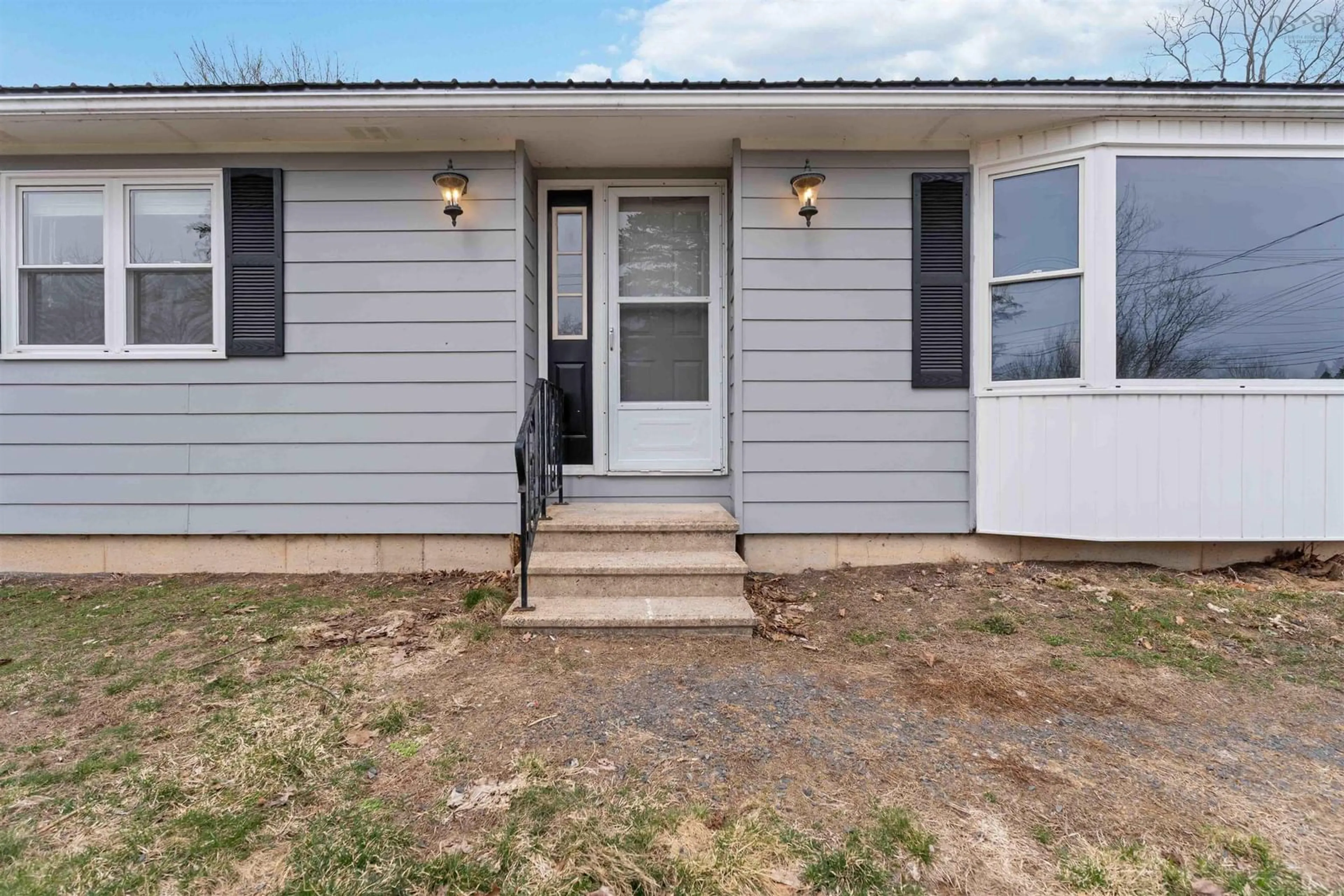 Home with vinyl exterior material, street for 909 Main St, Kingston Nova Scotia B0P 1R0