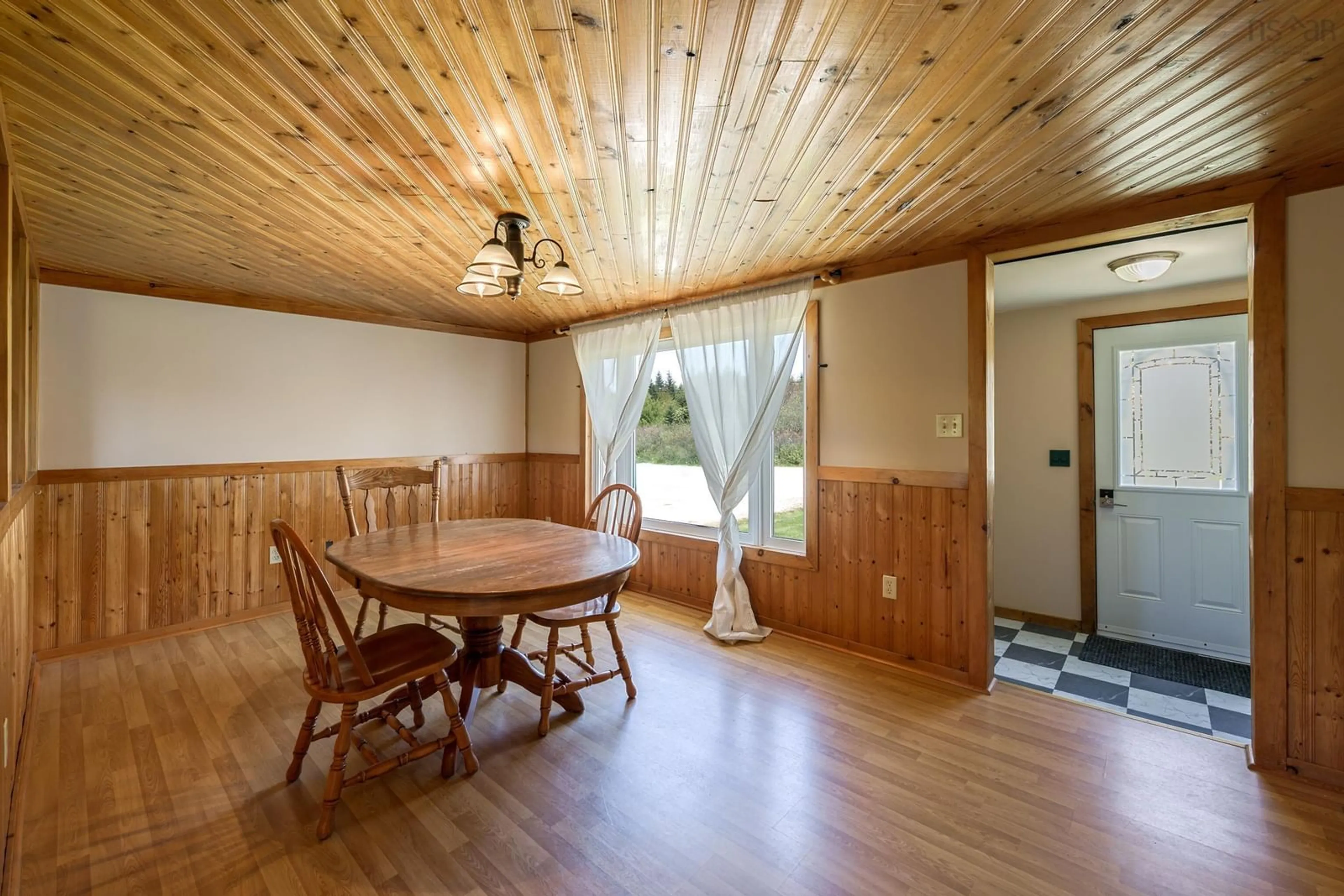 Dining room, wood/laminate floor for 211 Ellis Rd, Sand Beach Nova Scotia B5A 5G5