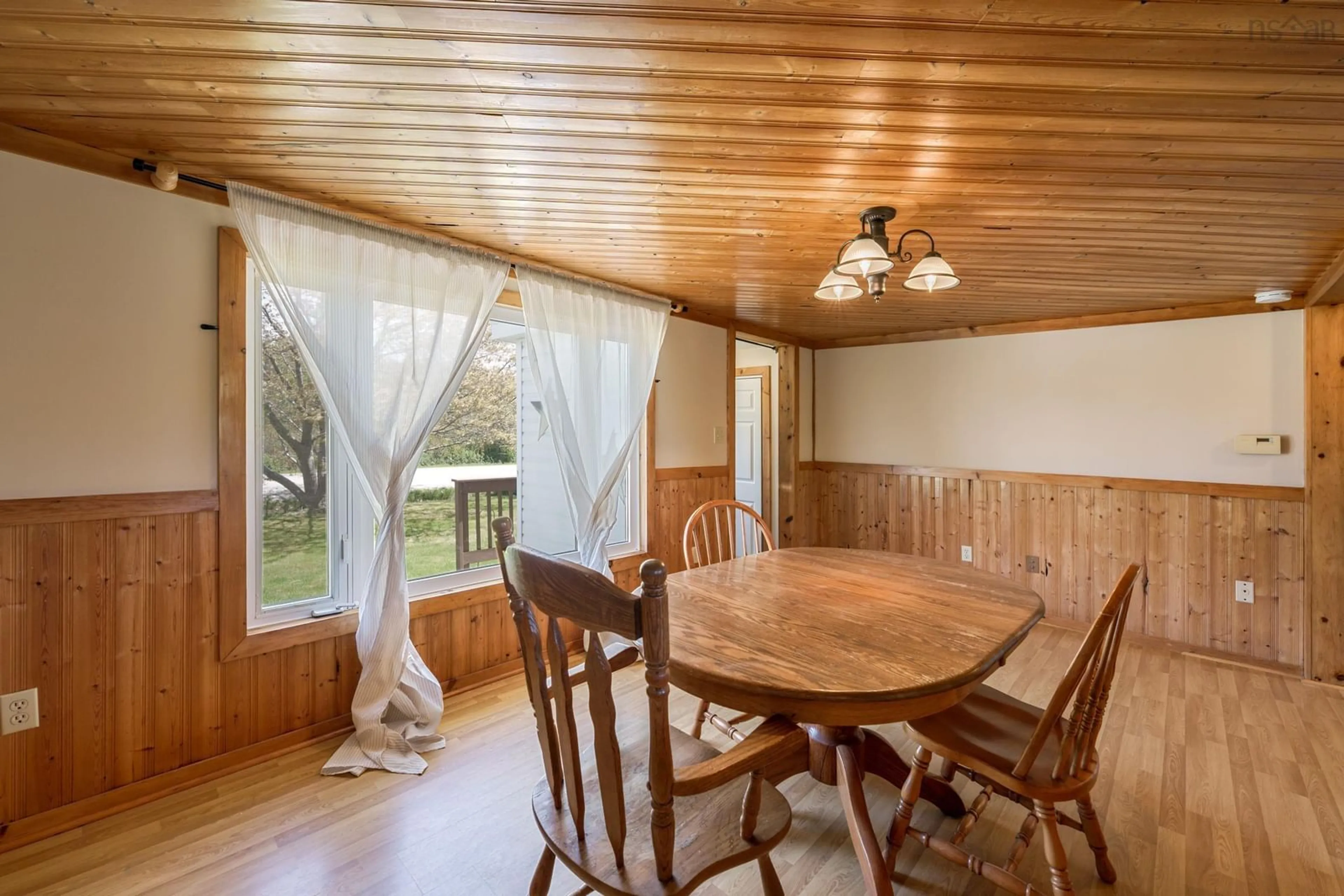 Dining room, wood/laminate floor for 211 Ellis Rd, Sand Beach Nova Scotia B5A 5G5