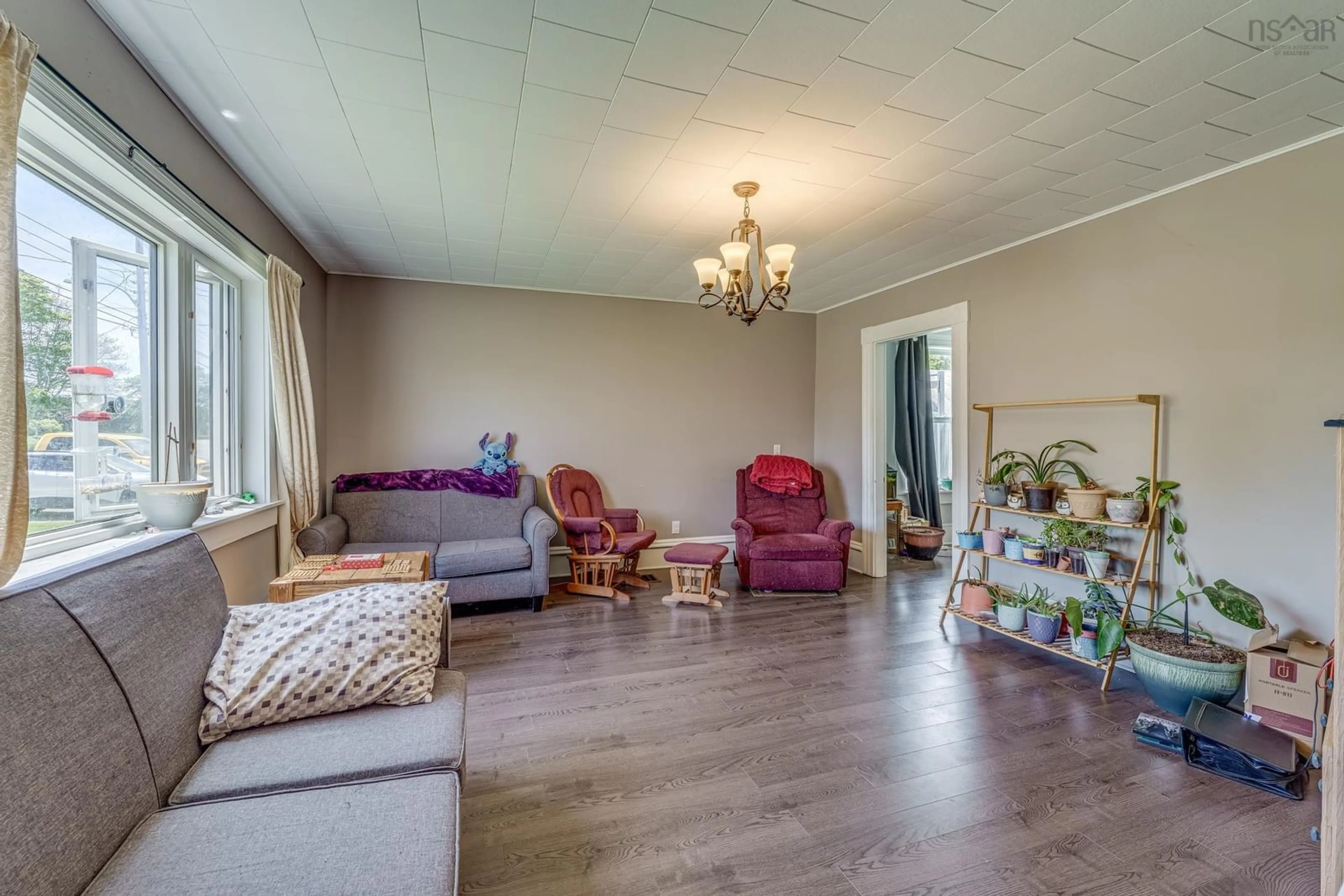 Living room with furniture, wood/laminate floor for Highway 1 #3163, Belliveaus Cove Nova Scotia B0W 1M0