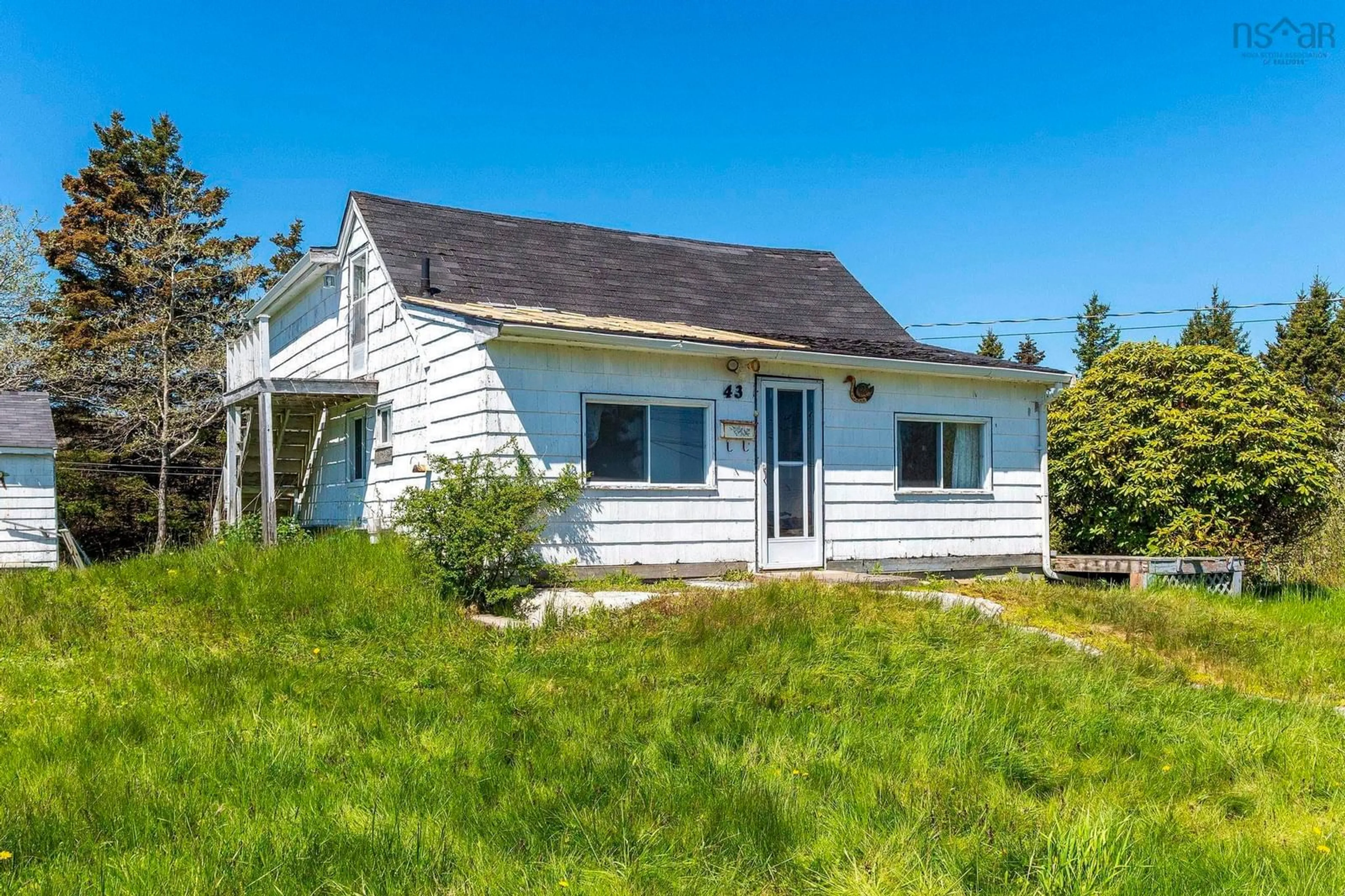 Home with vinyl exterior material, street for 43 South Point Rd, Portuguese Cove Nova Scotia B3V 1K3