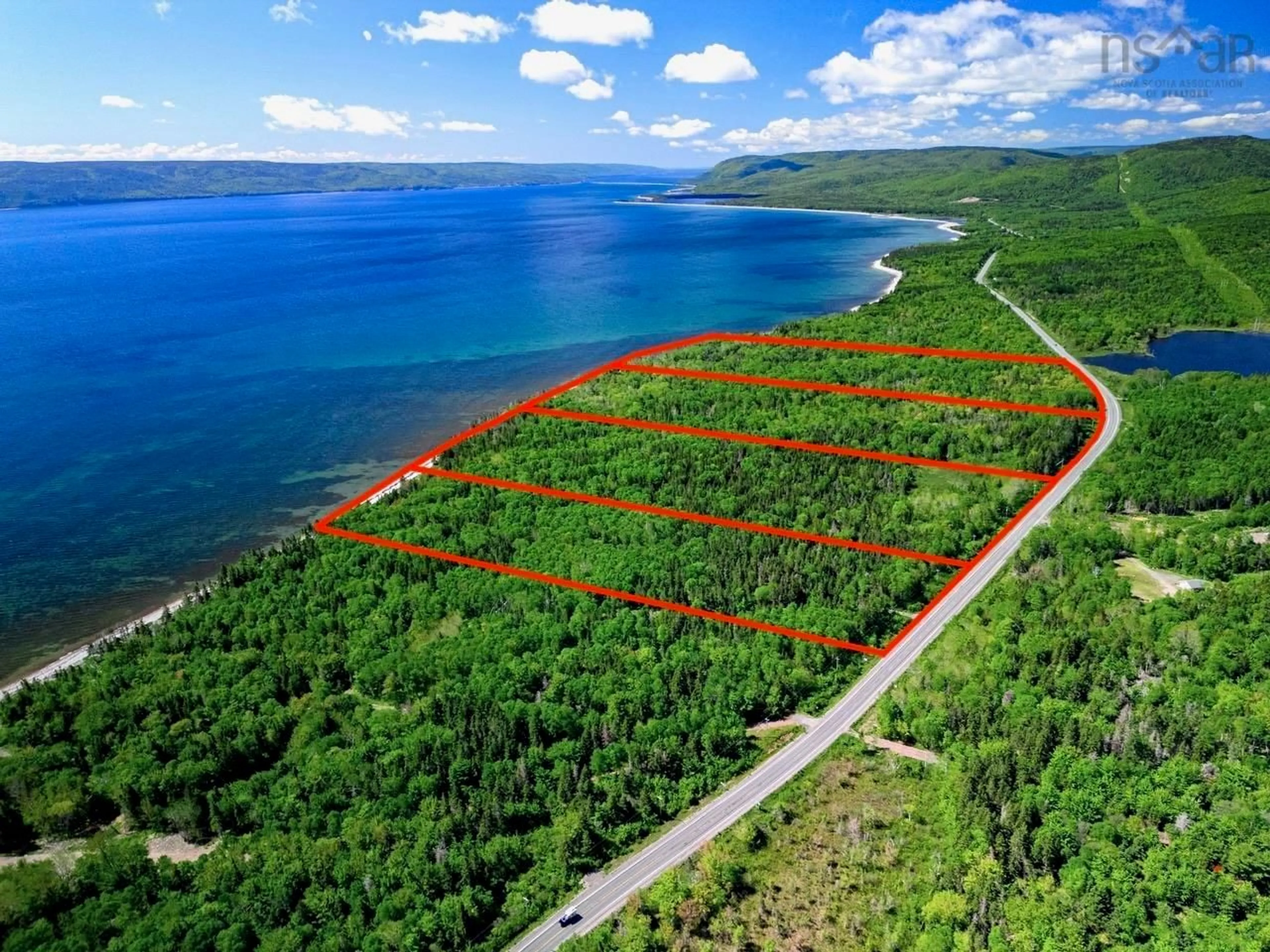 A pic from outside/outdoor area/front of a property/back of a property/a pic from drone, water/lake/river/ocean view for Cabot Trail #1-24, Indian Brook Nova Scotia B0C 1H0