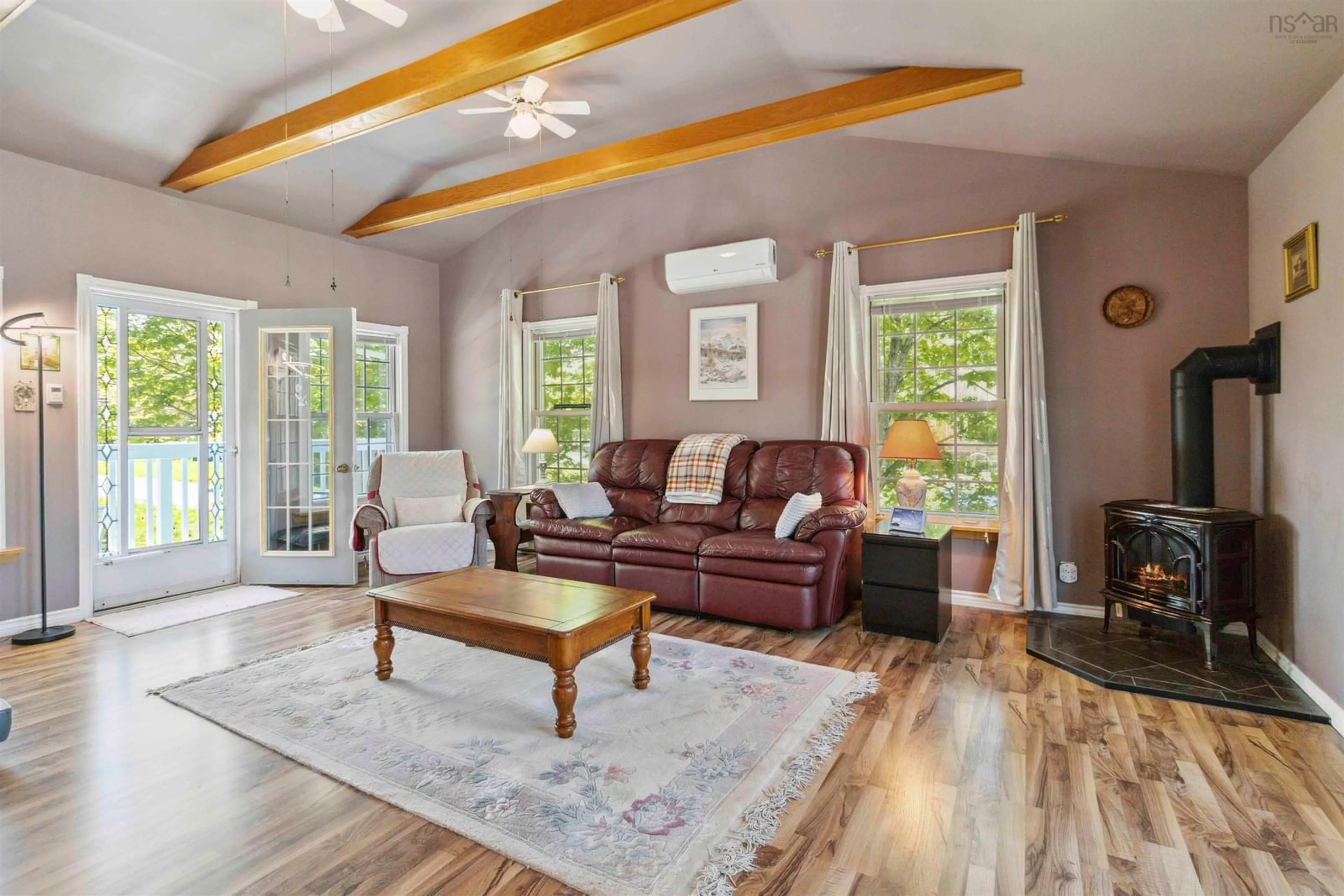 Living room with furniture, wood/laminate floor for 147 Shore Rd, Mersey Point Nova Scotia B0T 1K0