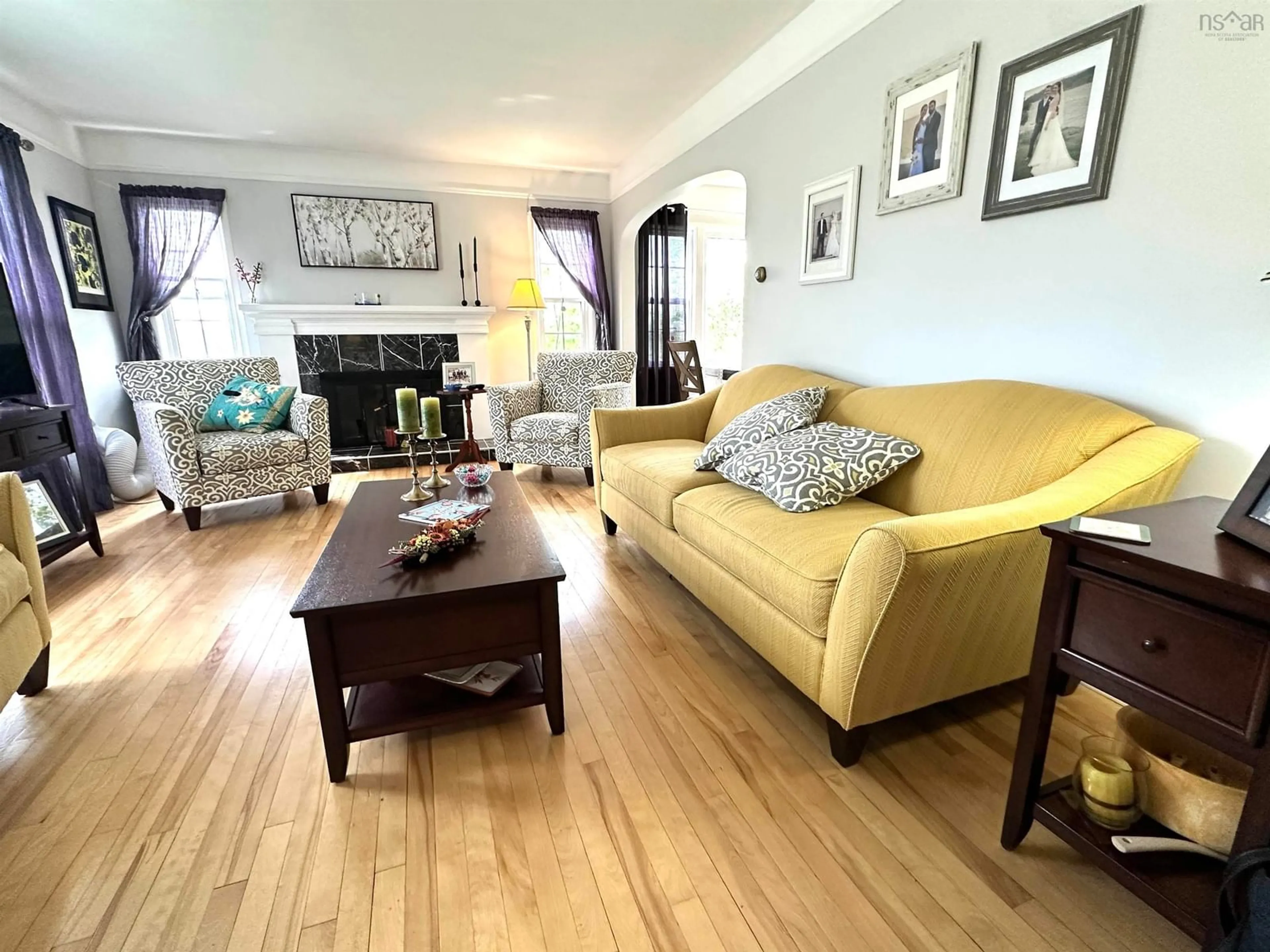 Living room with furniture, wood/laminate floor for 39 College St, Liverpool Nova Scotia B0T 1K0