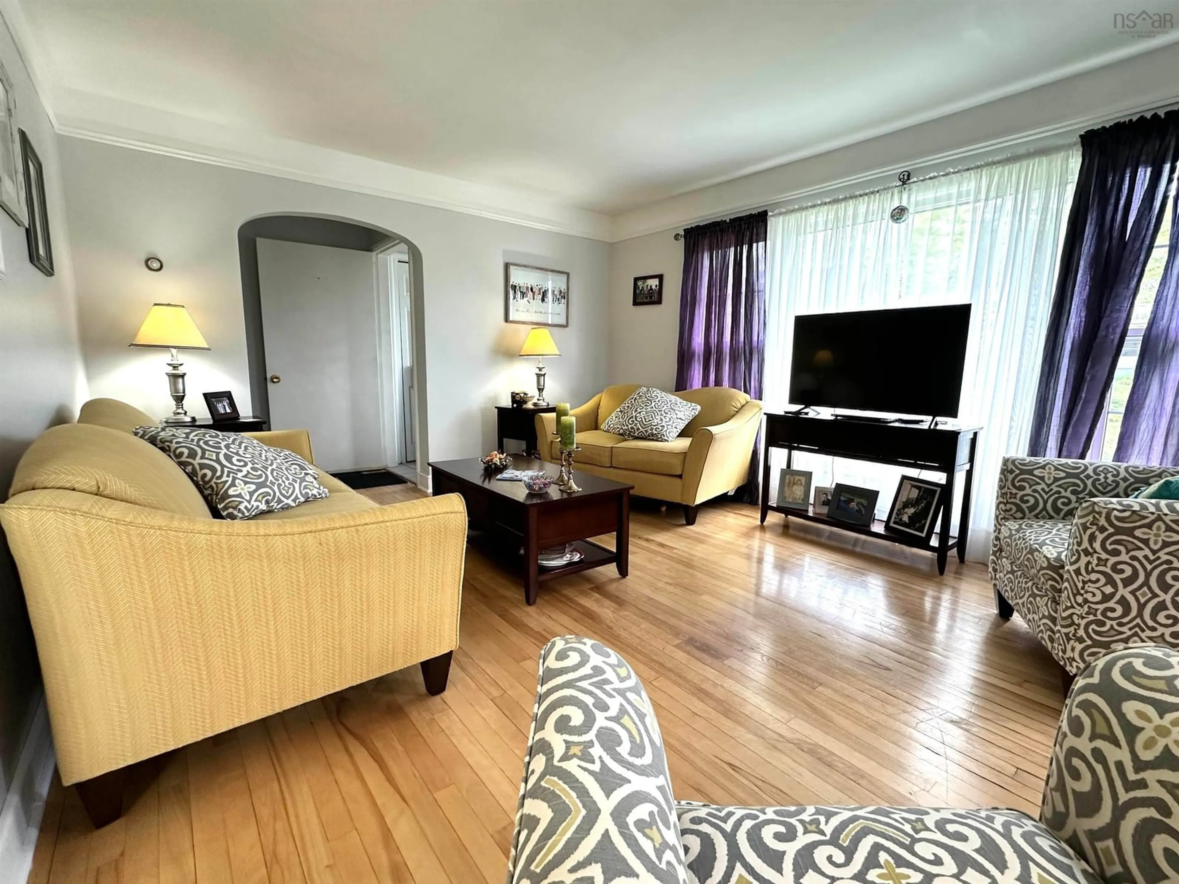 Living room with furniture, wood/laminate floor for 39 College St, Liverpool Nova Scotia B0T 1K0