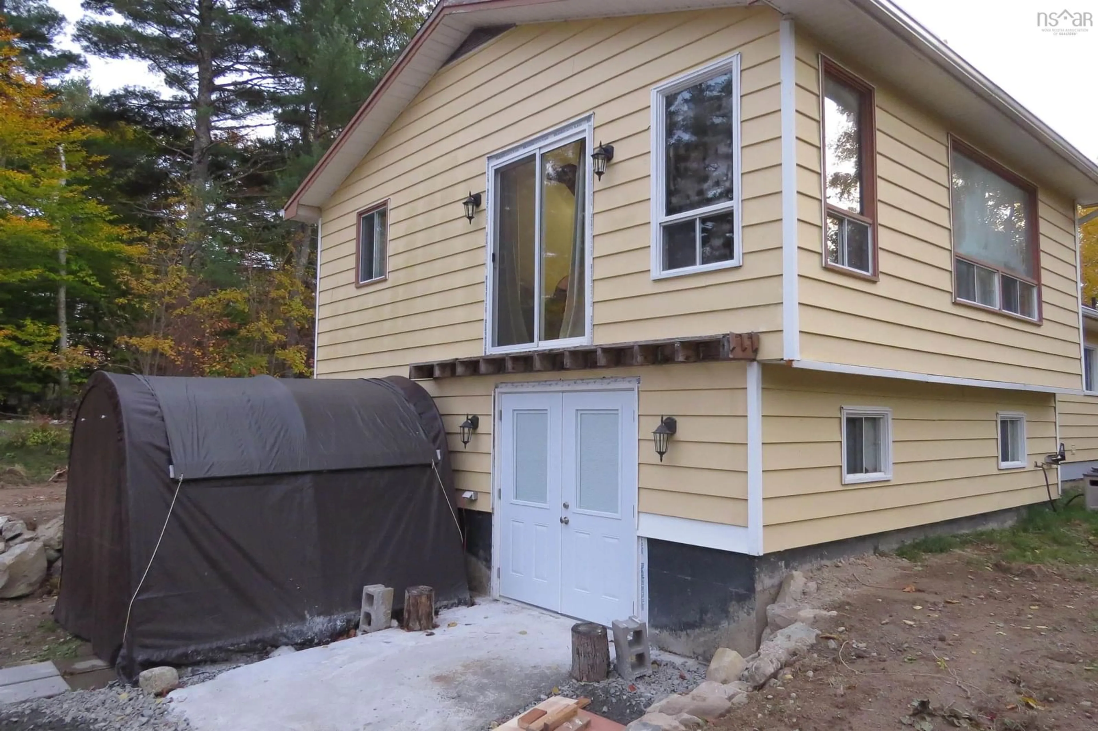 Home with vinyl exterior material, street for 2163 Labelle Rd, Molega Nova Scotia B0T 1X0