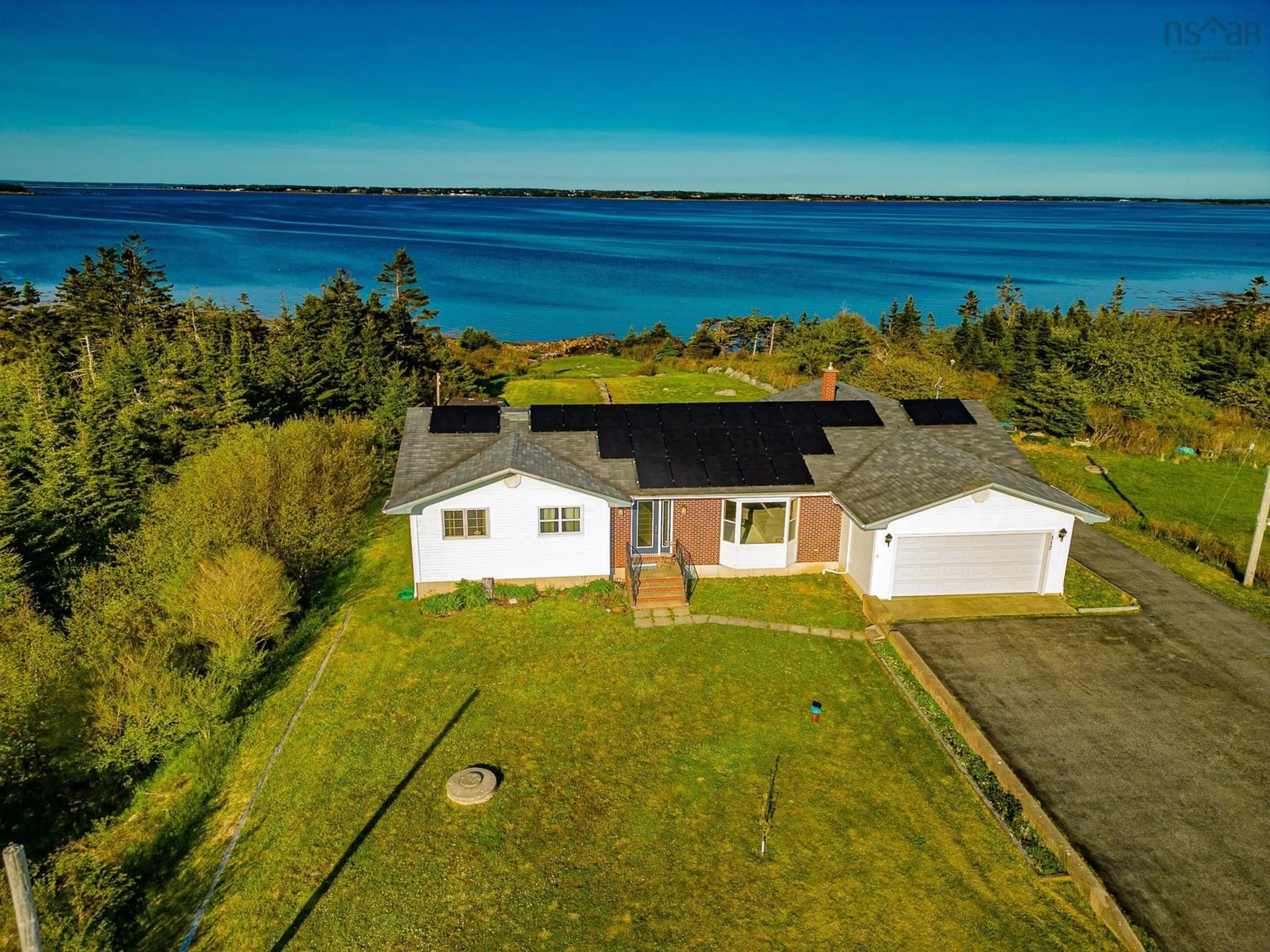 A pic from outside/outdoor area/front of a property/back of a property/a pic from drone, water/lake/river/ocean view for 317 Bear Point Rd, Bear Point Nova Scotia B0W 3B0