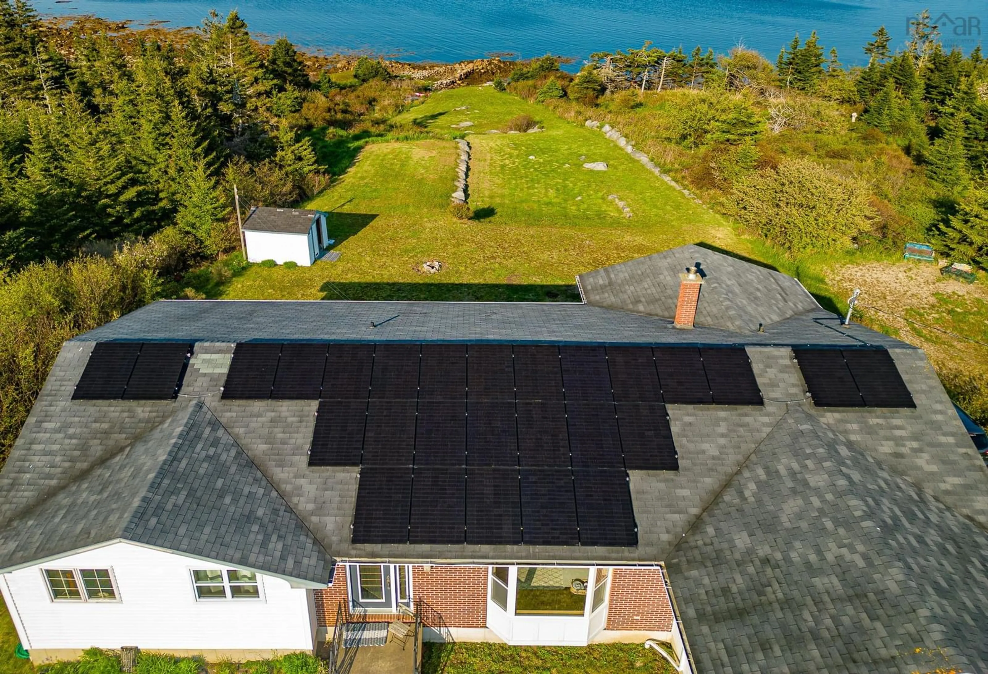 A pic from outside/outdoor area/front of a property/back of a property/a pic from drone, water/lake/river/ocean view for 317 Bear Point Rd, Bear Point Nova Scotia B0W 3B0