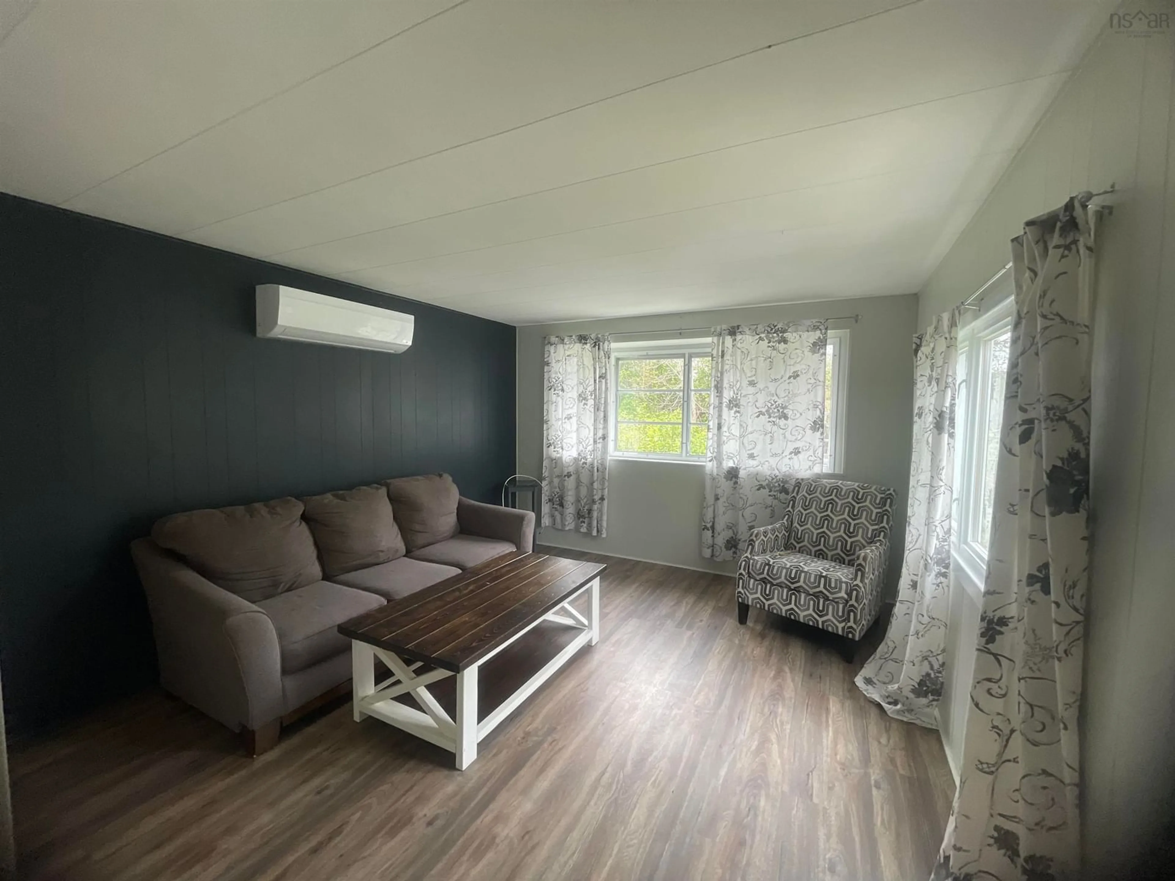 Living room with furniture, wood/laminate floor for 2935 Highway 3, Brass Hill Nova Scotia B0W 1E0