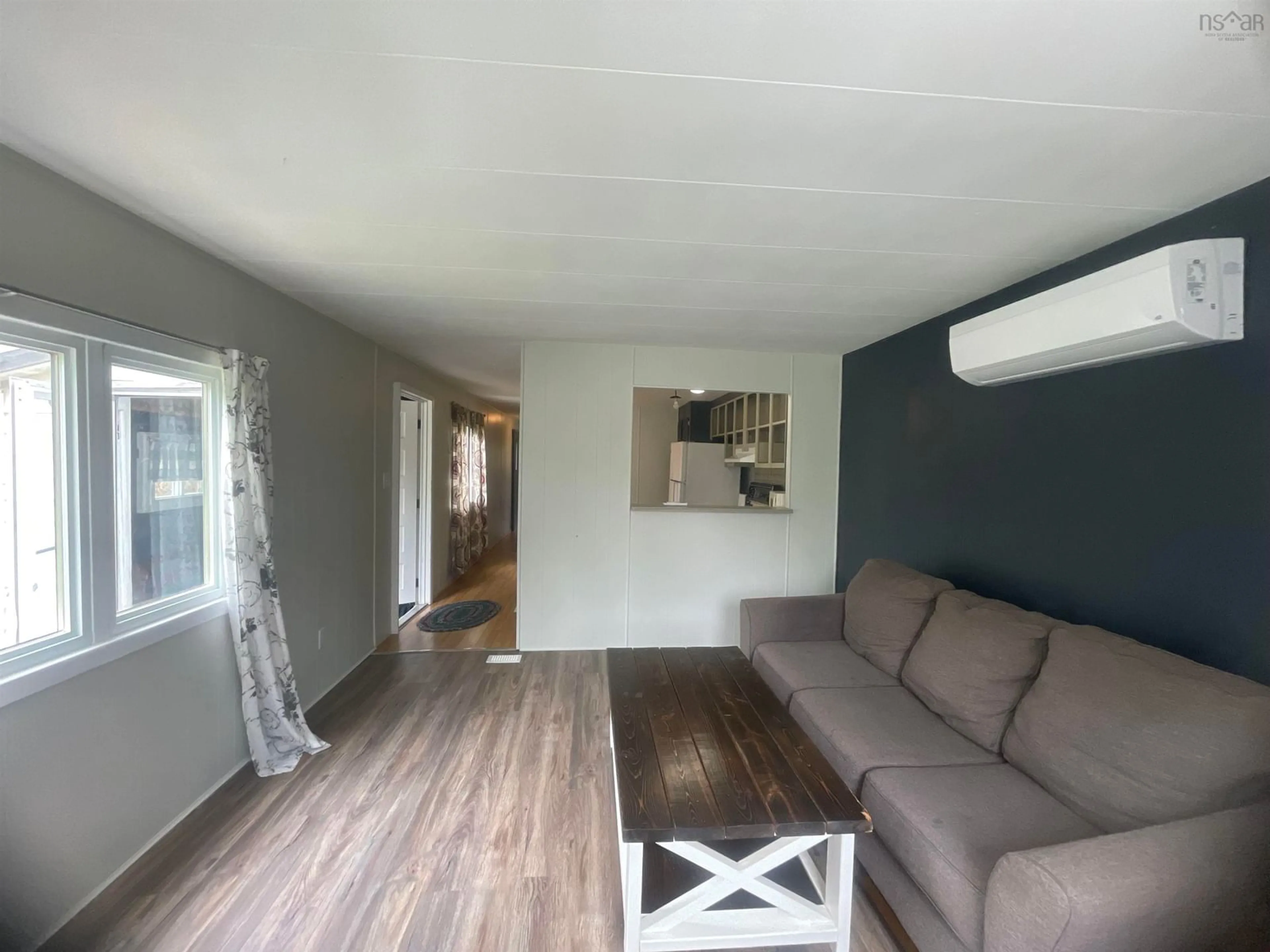 Living room with furniture, wood/laminate floor for 2935 Highway 3, Brass Hill Nova Scotia B0W 1E0