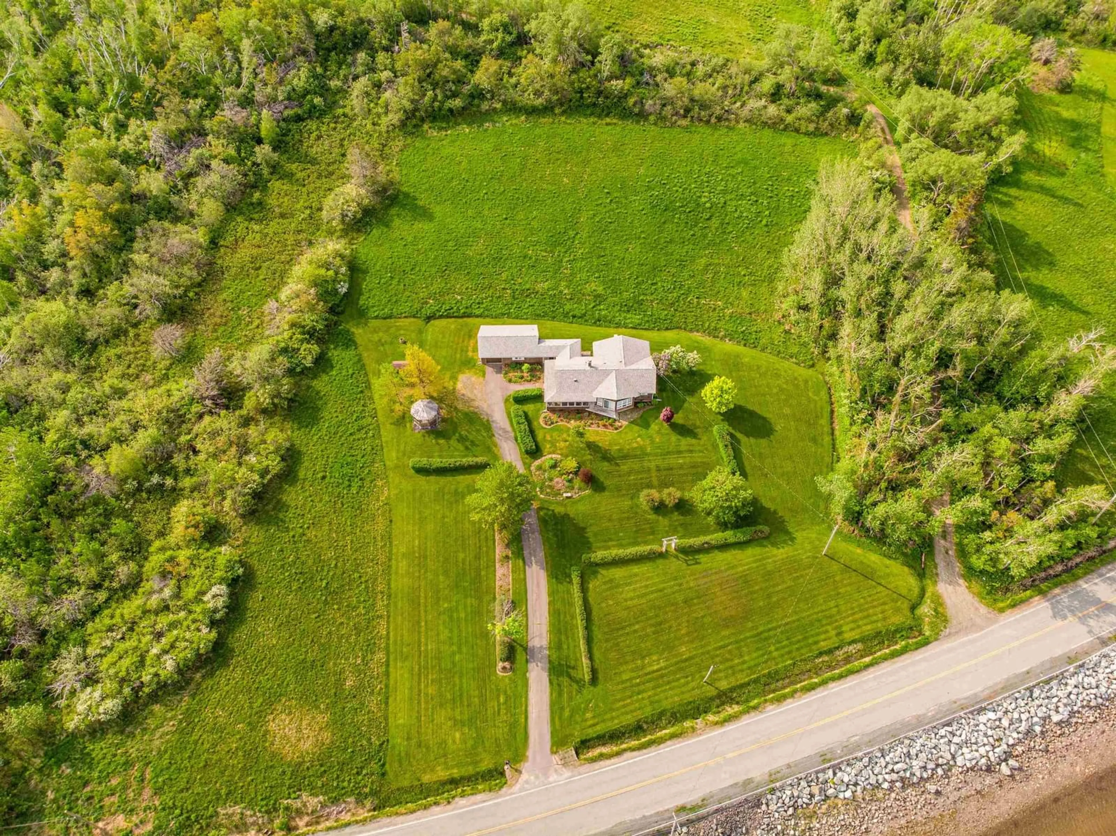 A pic from outside/outdoor area/front of a property/back of a property/a pic from drone, street for 1952 Shore Road, Merigomish, N.S., Merigomish Nova Scotia B0K 1G0