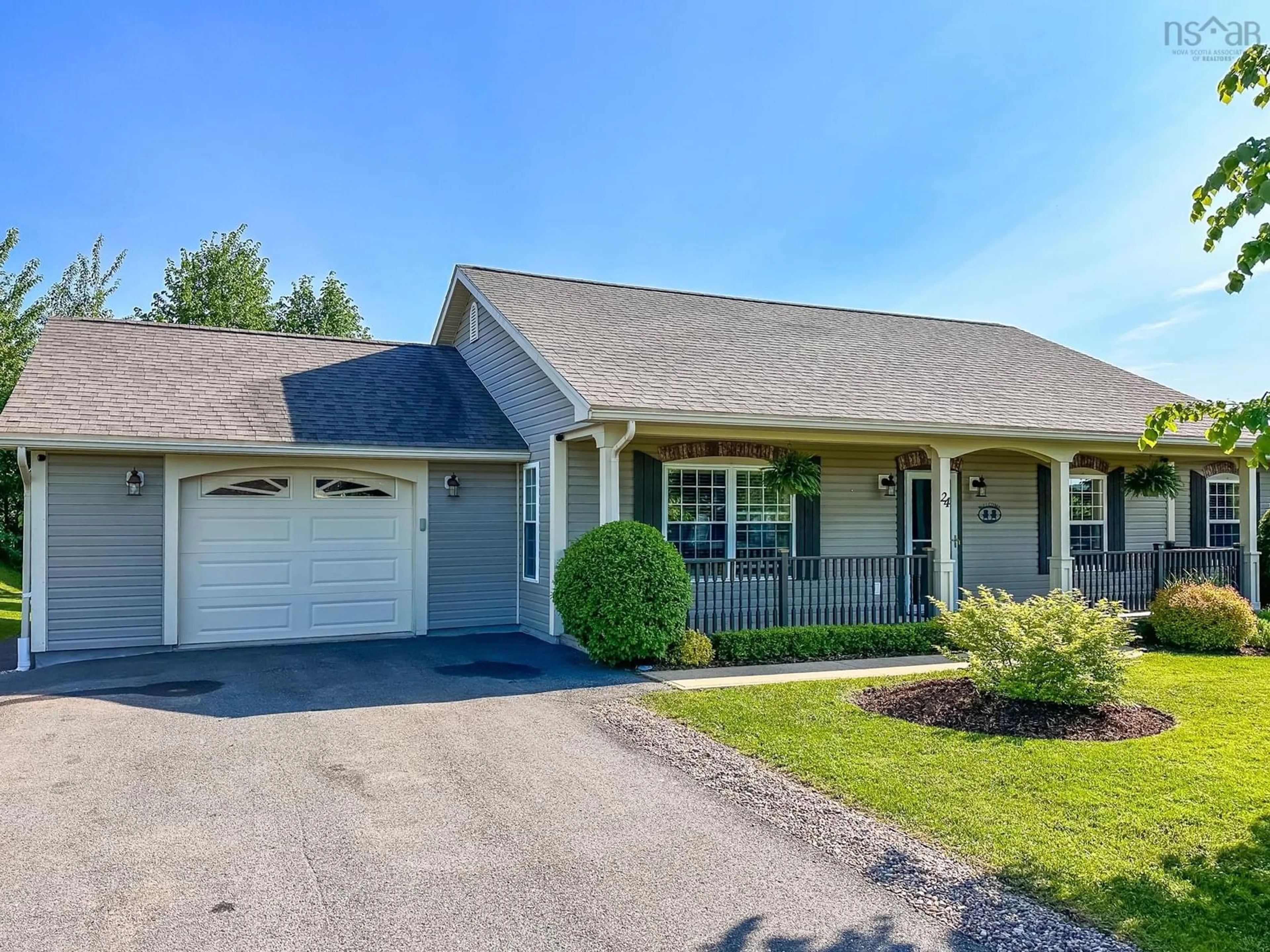 Home with vinyl exterior material, street for 24 Ports Landing Ave, Port Williams Nova Scotia B0P 1T0