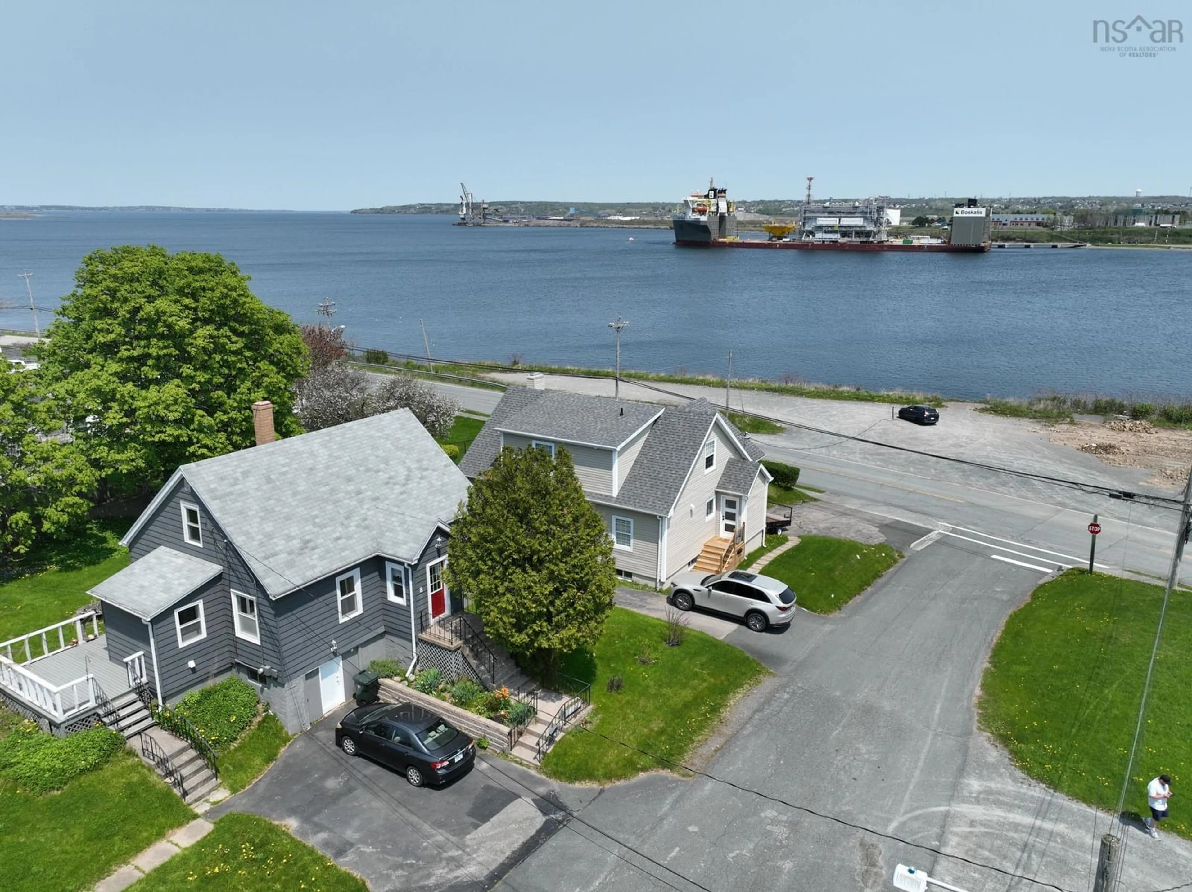 A pic from outside/outdoor area/front of a property/back of a property/a pic from drone, water/lake/river/ocean view for 8 Cloverdale Dr, Westmount Nova Scotia B1R 1H7