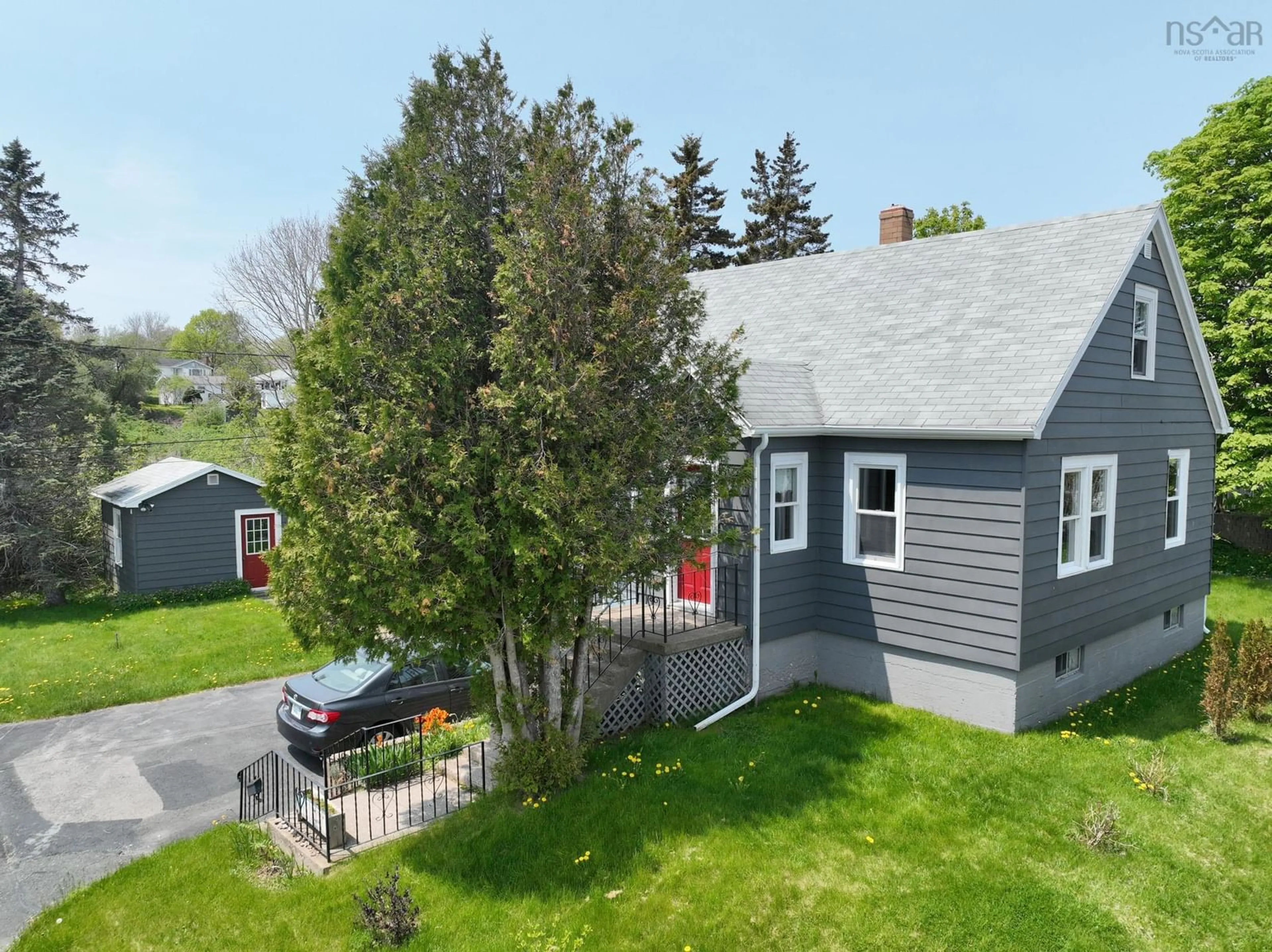 A pic from outside/outdoor area/front of a property/back of a property/a pic from drone, street for 8 Cloverdale Dr, Westmount Nova Scotia B1R 1H7