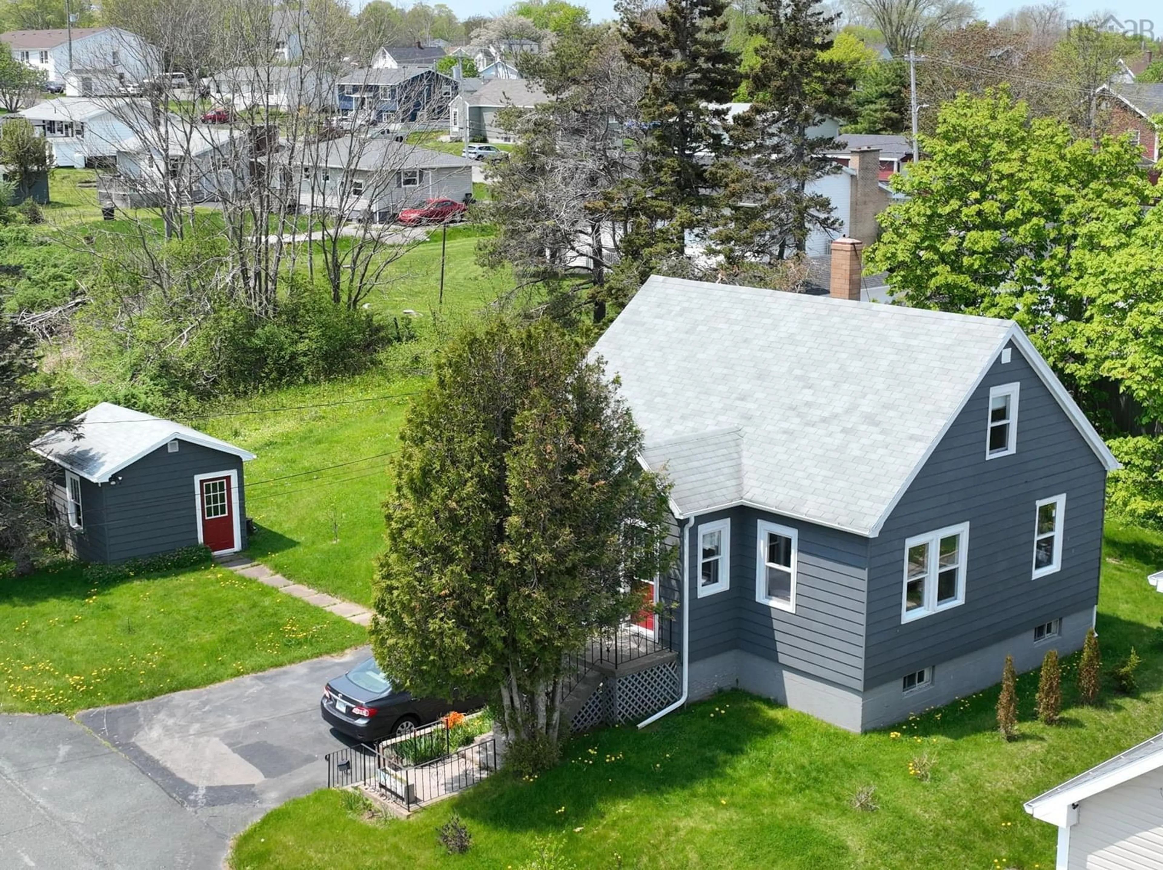 A pic from outside/outdoor area/front of a property/back of a property/a pic from drone, street for 8 Cloverdale Dr, Westmount Nova Scotia B1R 1H7