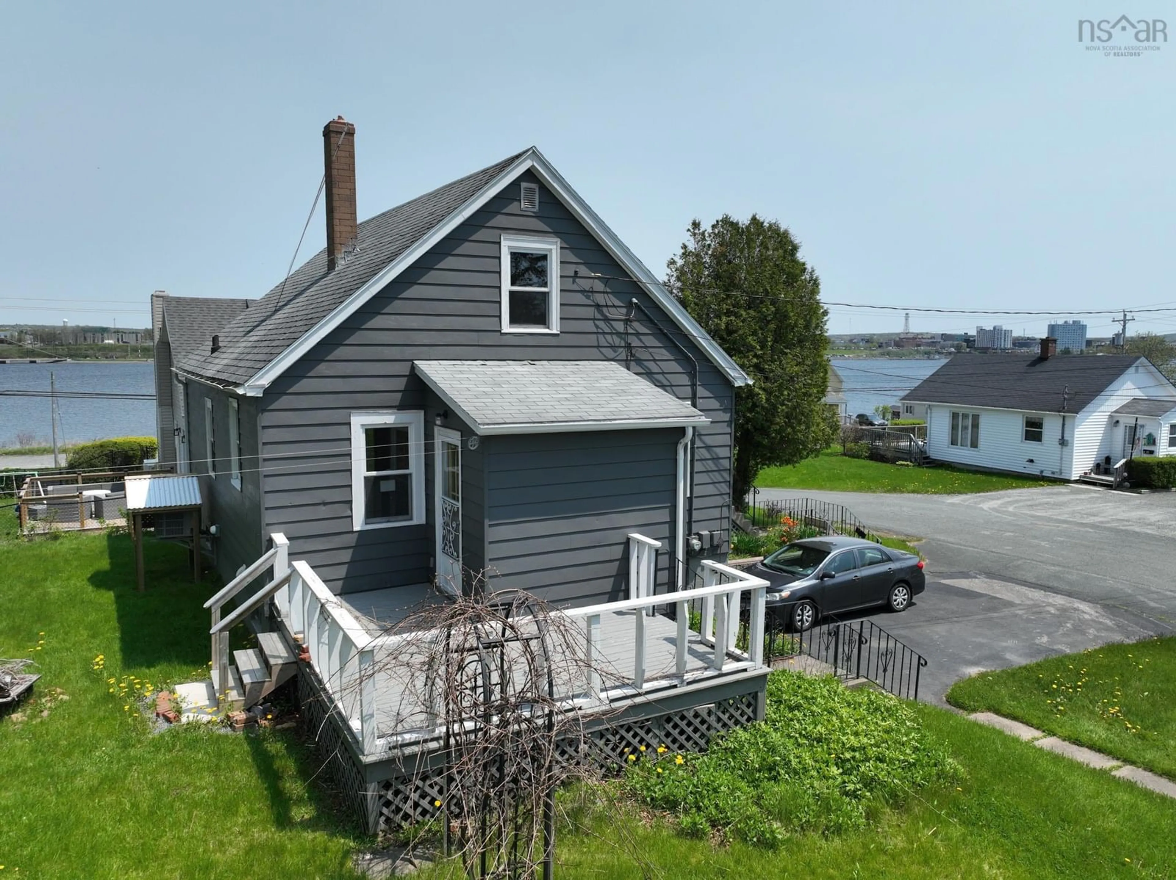 A pic from outside/outdoor area/front of a property/back of a property/a pic from drone, water/lake/river/ocean view for 8 Cloverdale Dr, Westmount Nova Scotia B1R 1H7