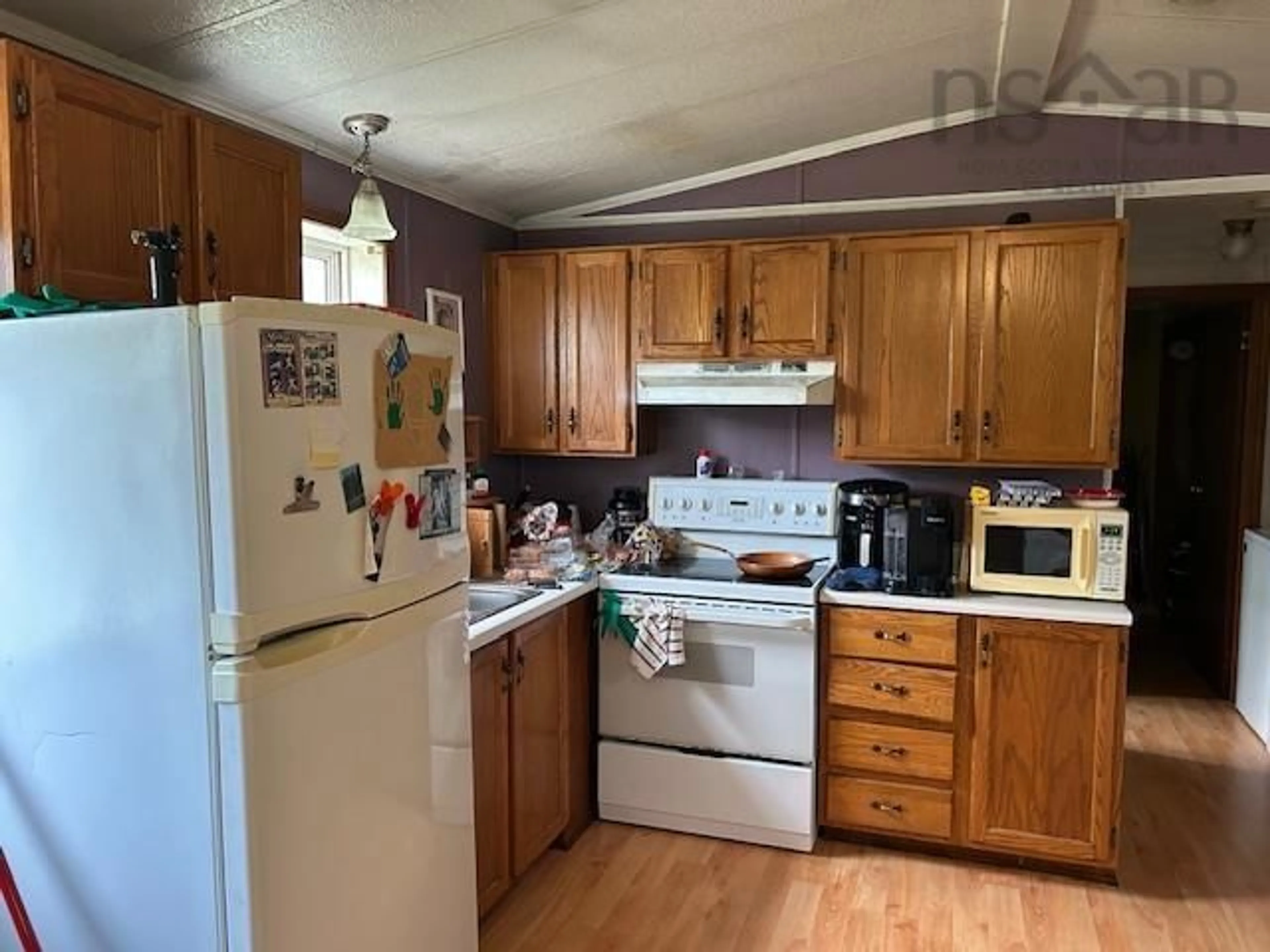 Standard kitchen, wood/laminate floor for 12 Burt Ave, Louisdale Nova Scotia B0E 1V0