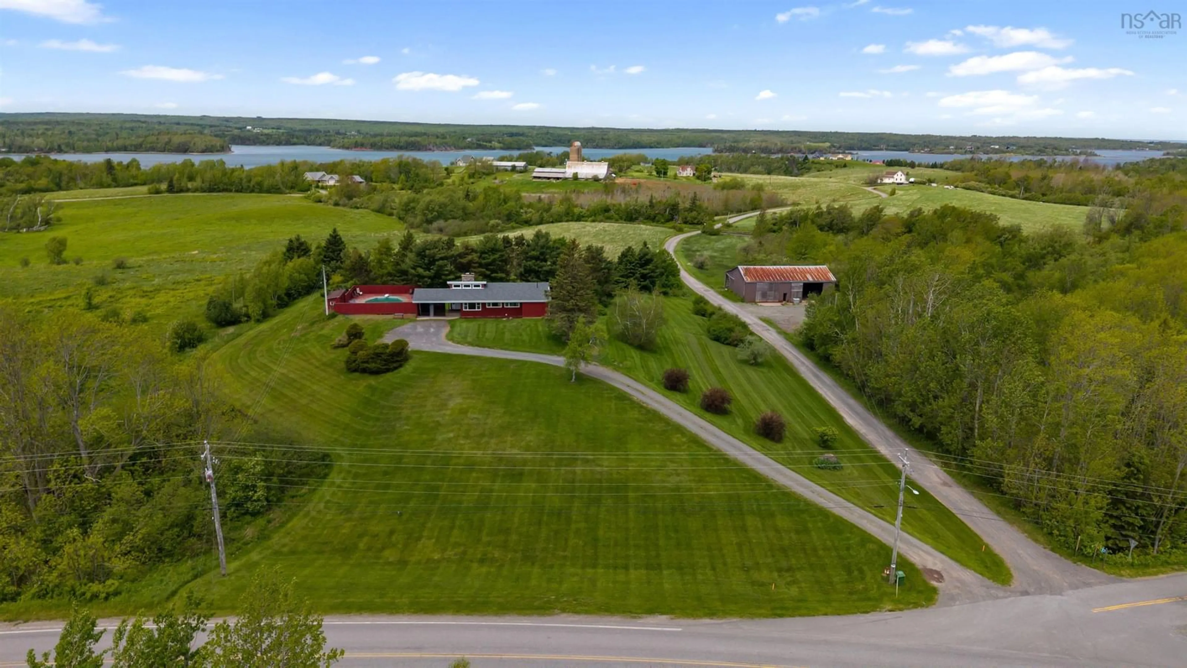 A pic from outside/outdoor area/front of a property/back of a property/a pic from drone, water/lake/river/ocean view for 393 Shore Rd, Egerton Nova Scotia B0K 1G0