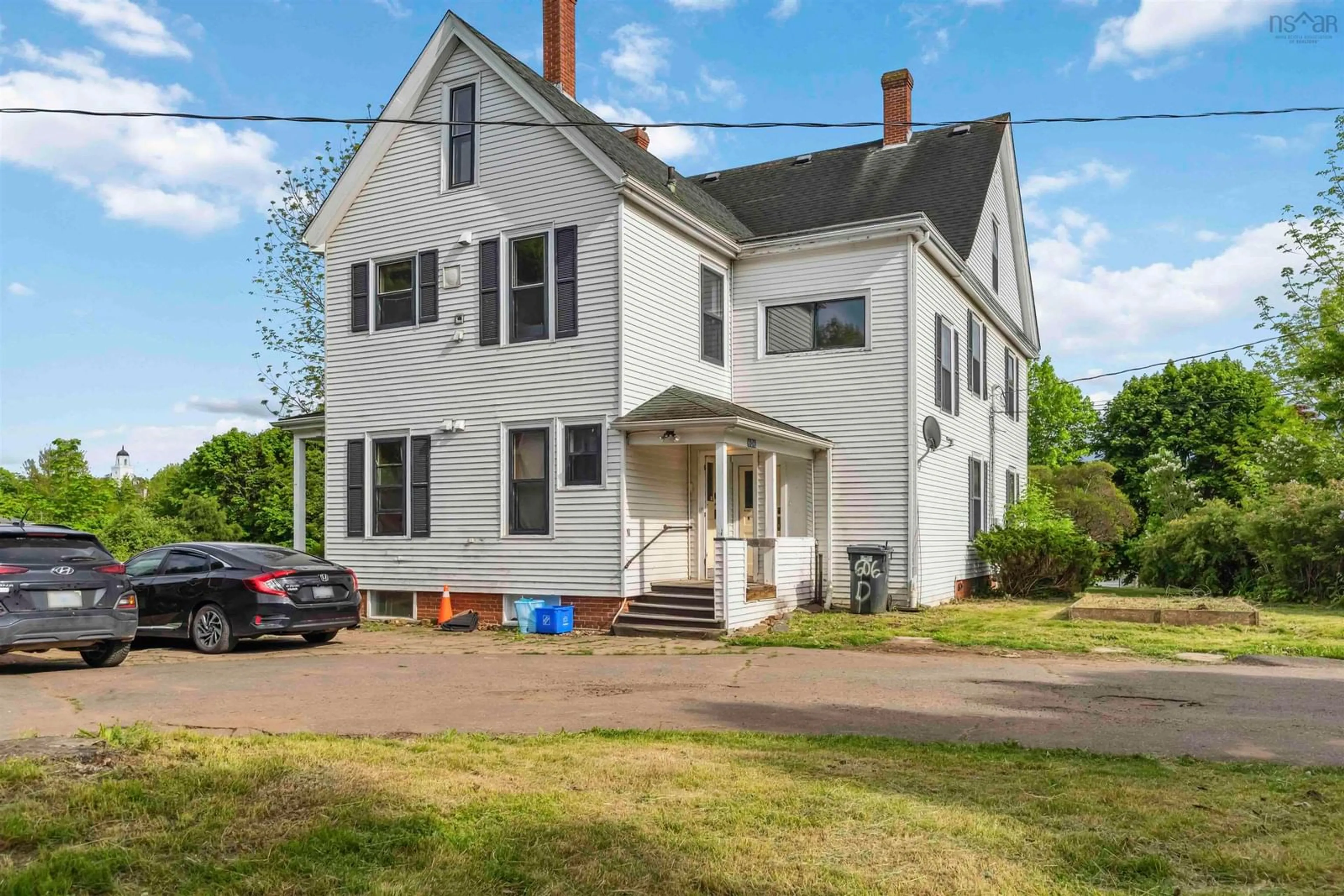 A pic from outside/outdoor area/front of a property/back of a property/a pic from drone, building for 606 Main St, Wolfville Nova Scotia B4P 1E8